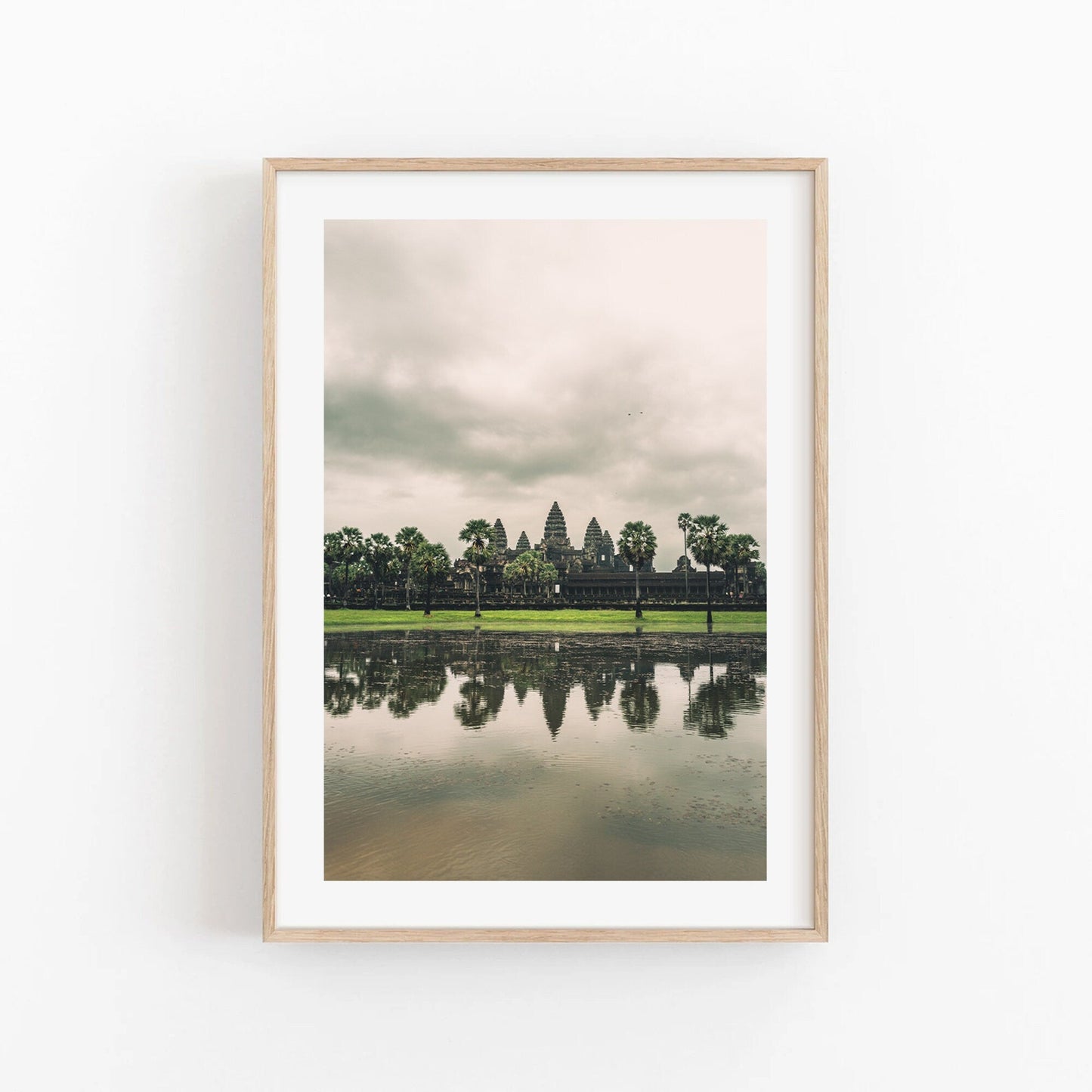 Angkor Wat photo: cloudy sky, water reflection.