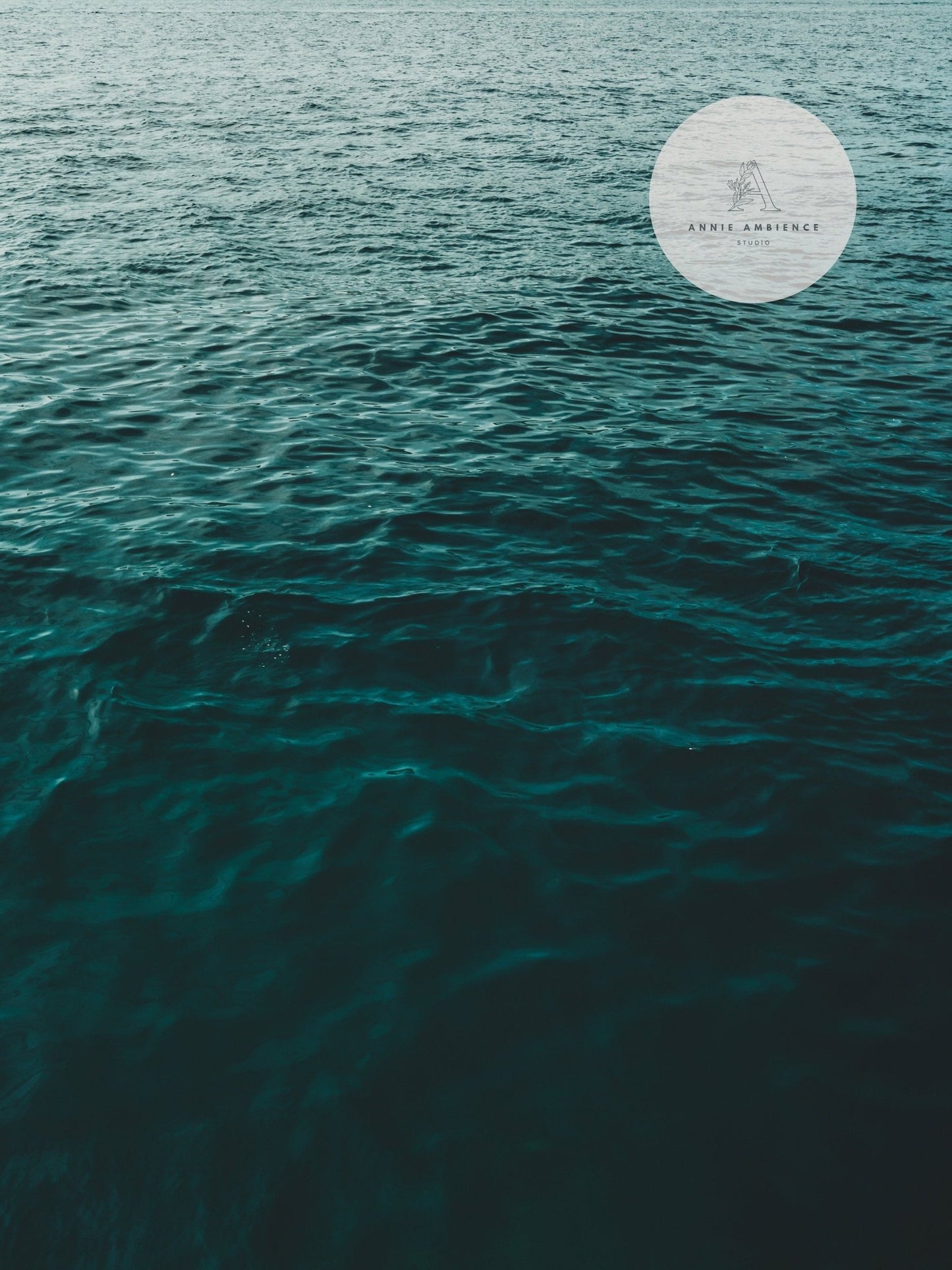 Teal ocean waves fill the image, featuring a circular overlay with Άγριλη Ανθρώπινη on Bright Shores - Set of 3.