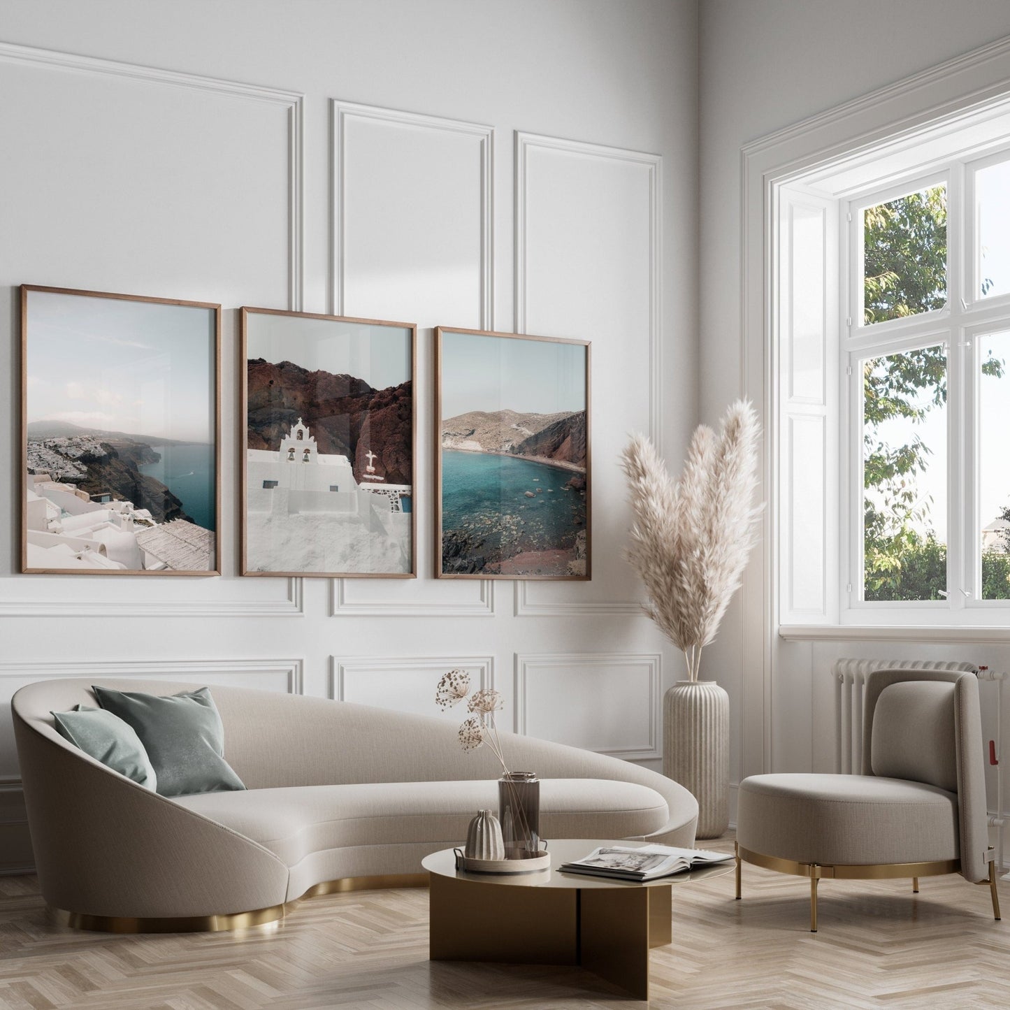 Elegant living room with a cream sofa, round table, pampas grass, large windows, and Colors of Santorini wall art.