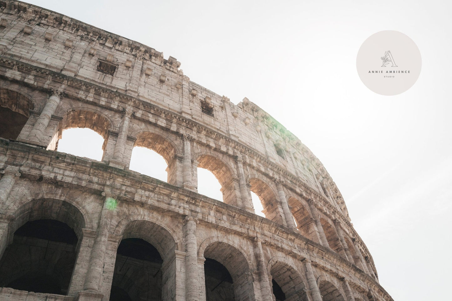 Heres Colosseum I, sunlit and highlighting its ancient arches against a clear Roman sky.