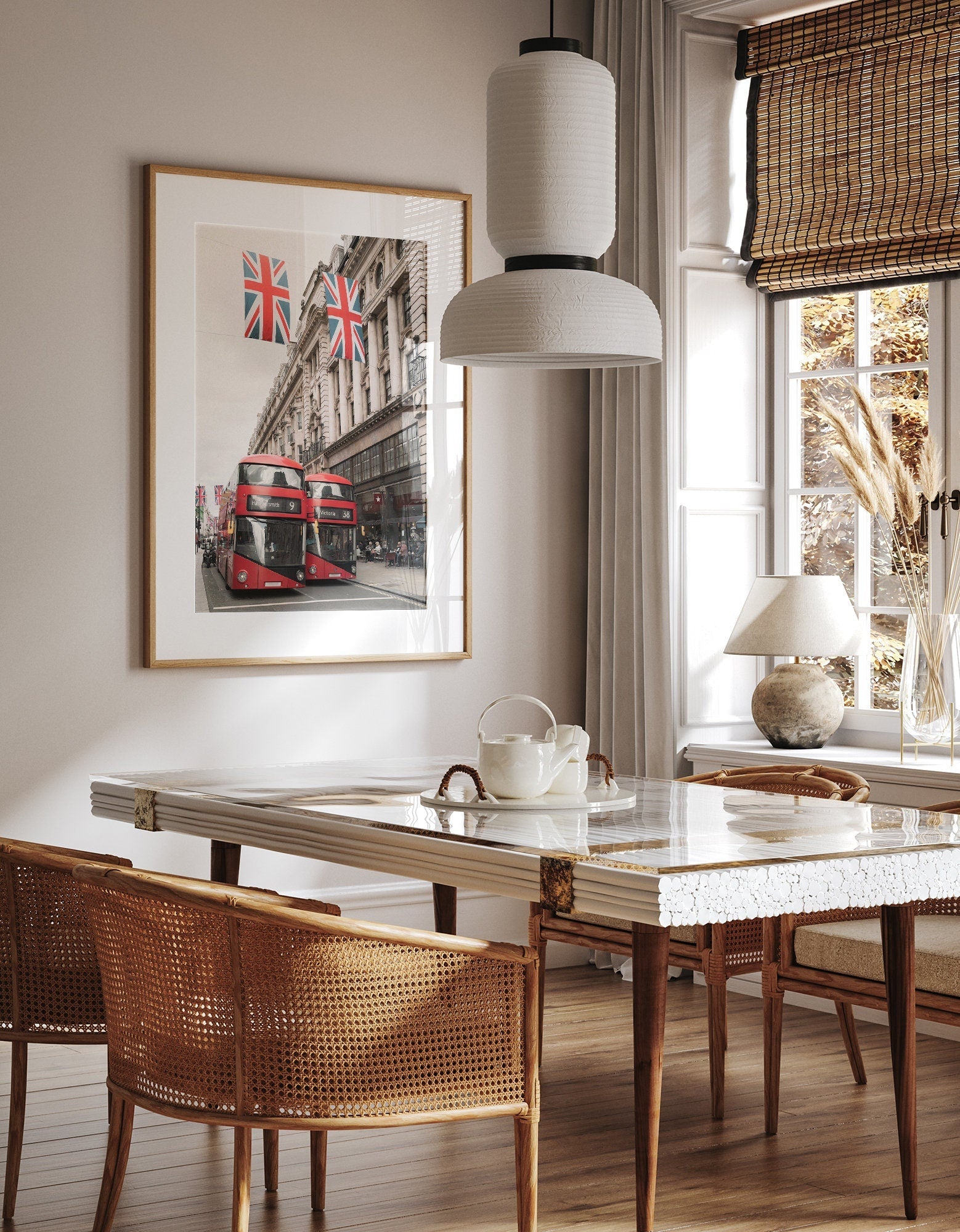Stylish dining room with a table set, wicker chairs, and a framed Double-deckers picture on the wall.