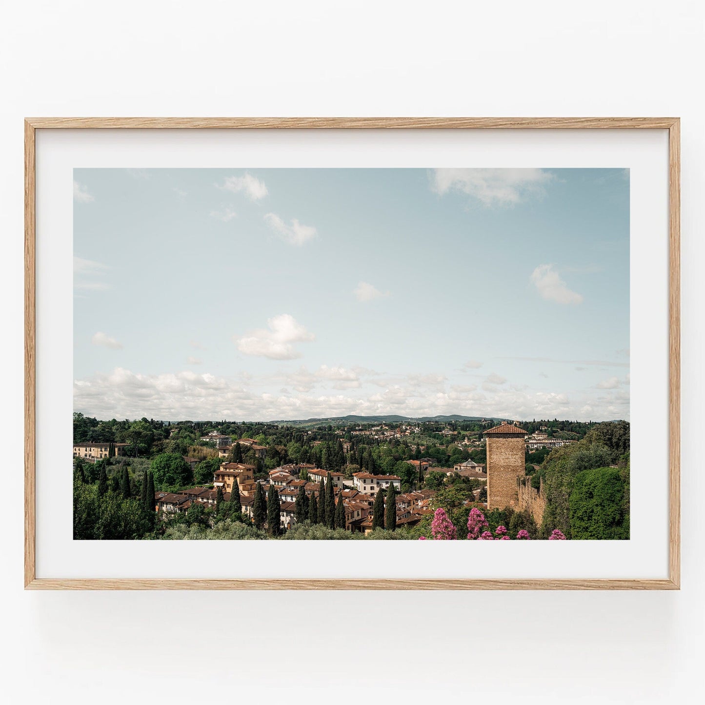 Florence Countryside framed photo: scenic town, trees, red-roofed buildings, tower under a cloudy sky.