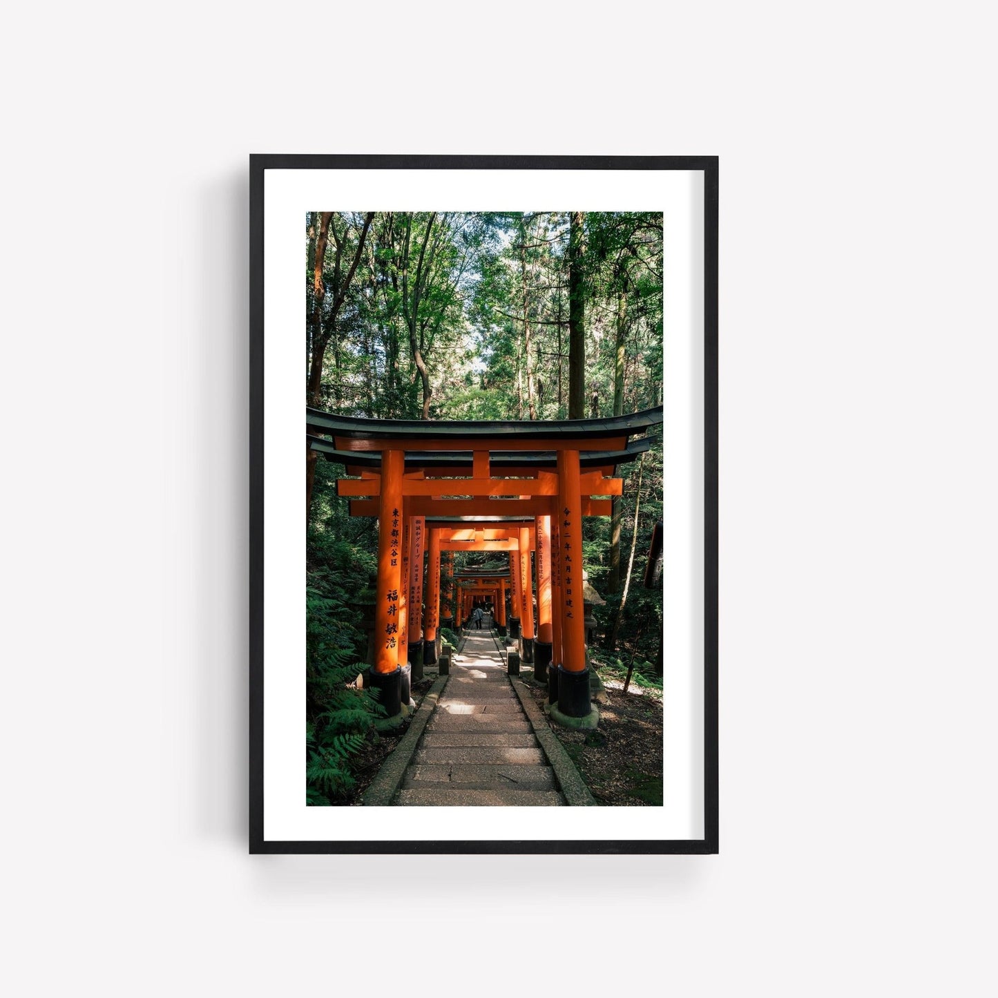 Framed photo titled Fushimi Inari Taisha I depicting a forest path with red torii gates.