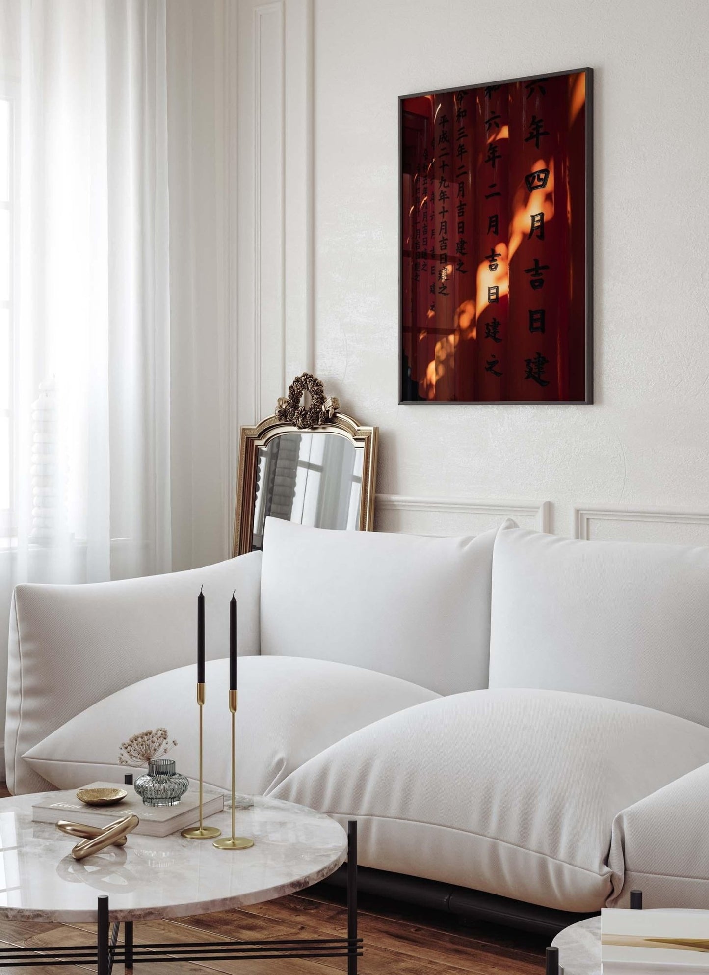 A cozy living room with a white sofa, marble table, and the Fushimi Inari Taisha II calligraphy painting framed on the wall.