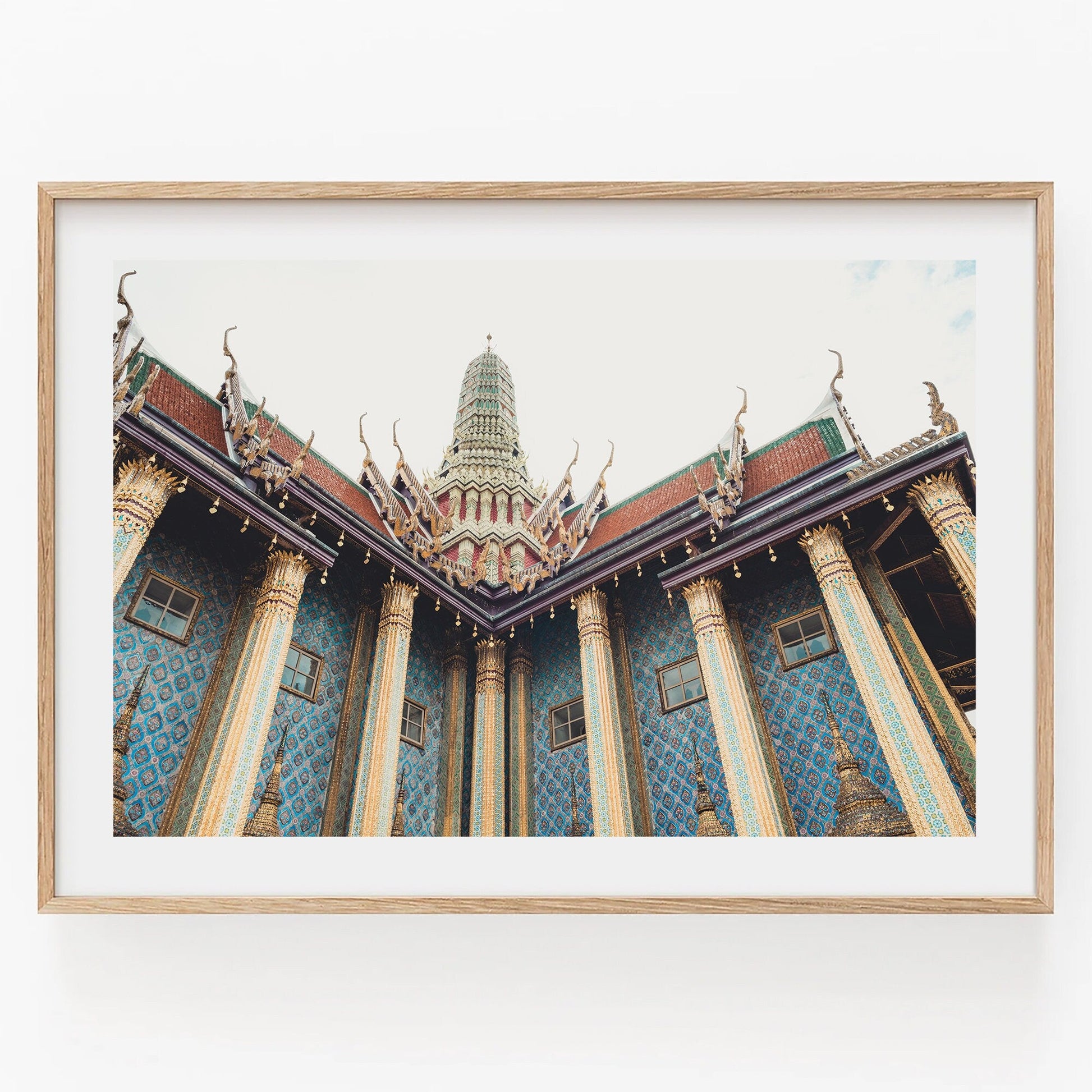 Framed photo Grand Palace IV showing blue patterned walls & gold columns, captured from below against a white sky.