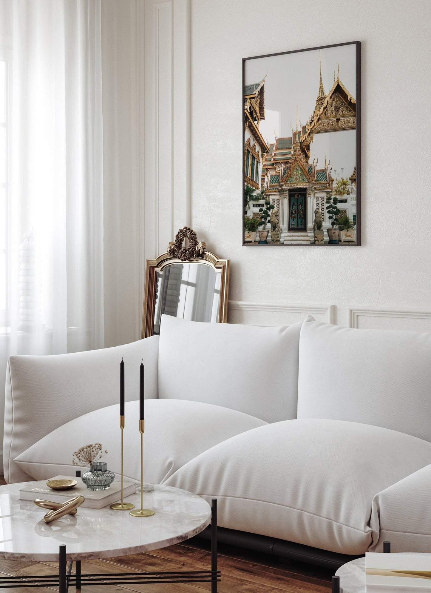 A modern living room featuring the Grand Palace V sofa, marble table, candles, and a framed picture on the wall.