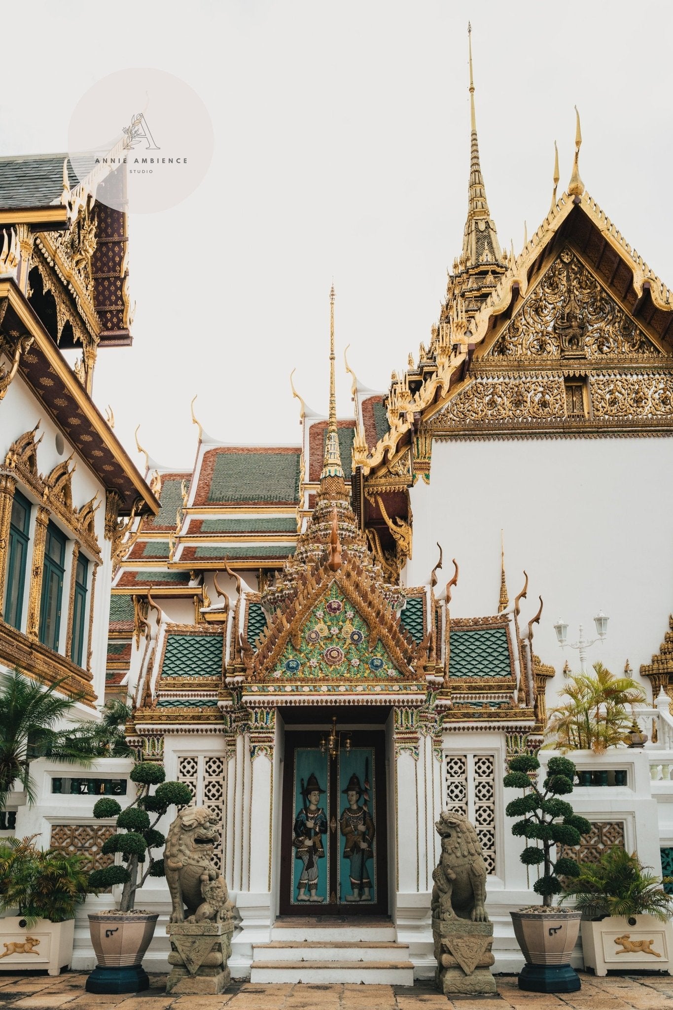 Grand Palace V: An ornate Thai temple with intricate decorations, detailed roof designs, statues, and potted plants.