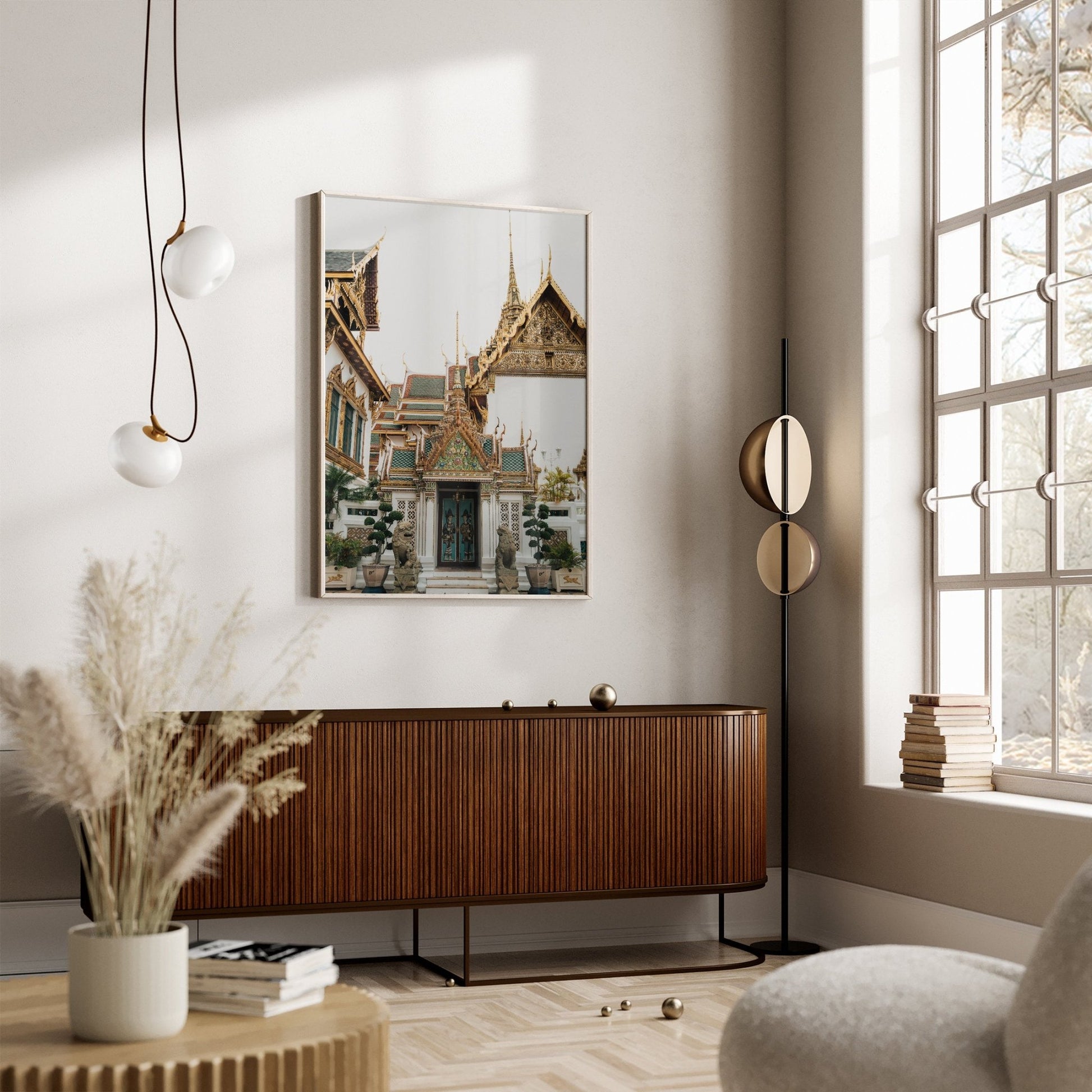 Minimalist living room with large window, wooden sideboard, modern lamps, and Grand Palace V wall art.