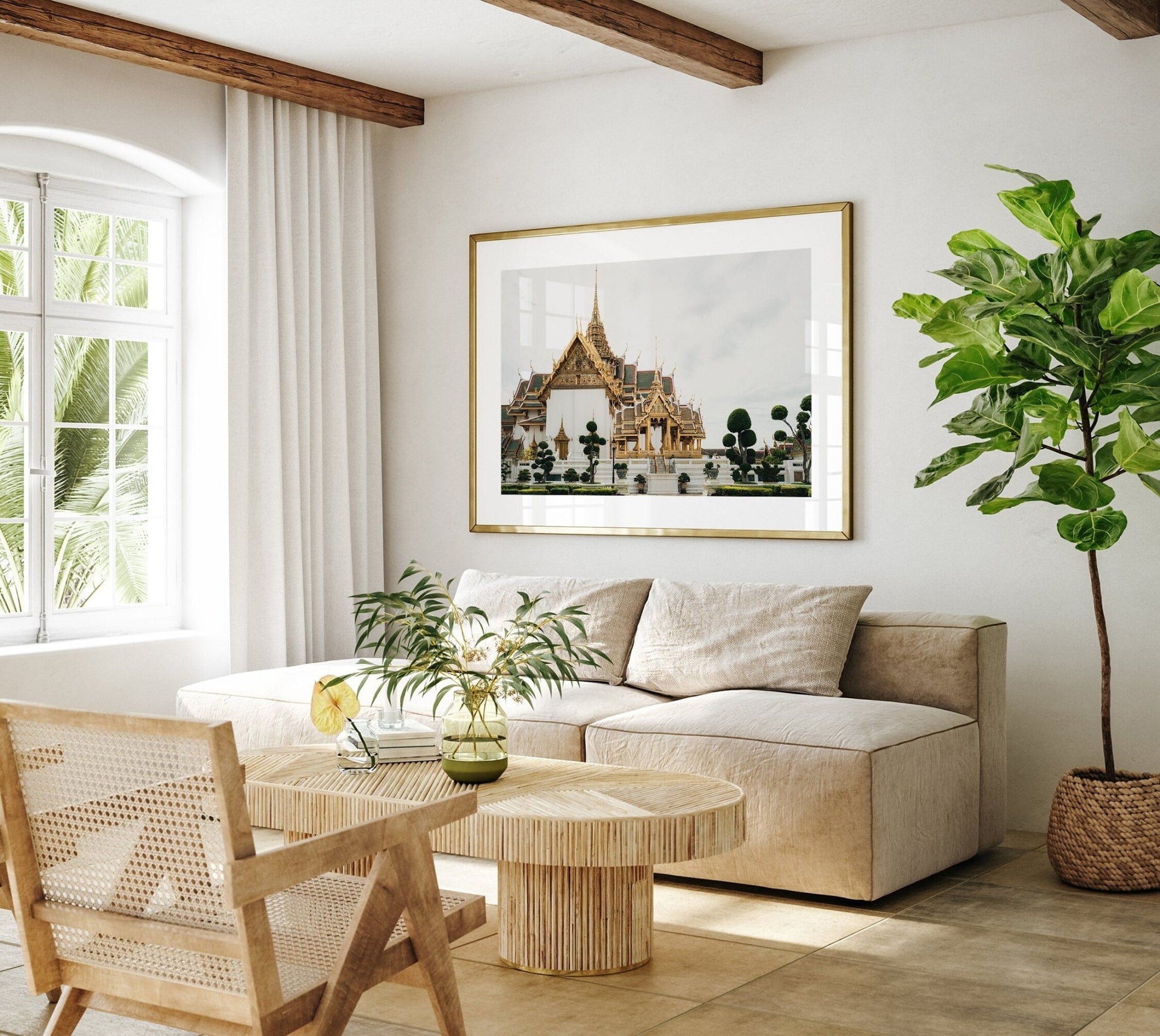 Minimalist living room featuring Grand Palace VII couch, framed artwork, wooden table and chair, with a potted plant.