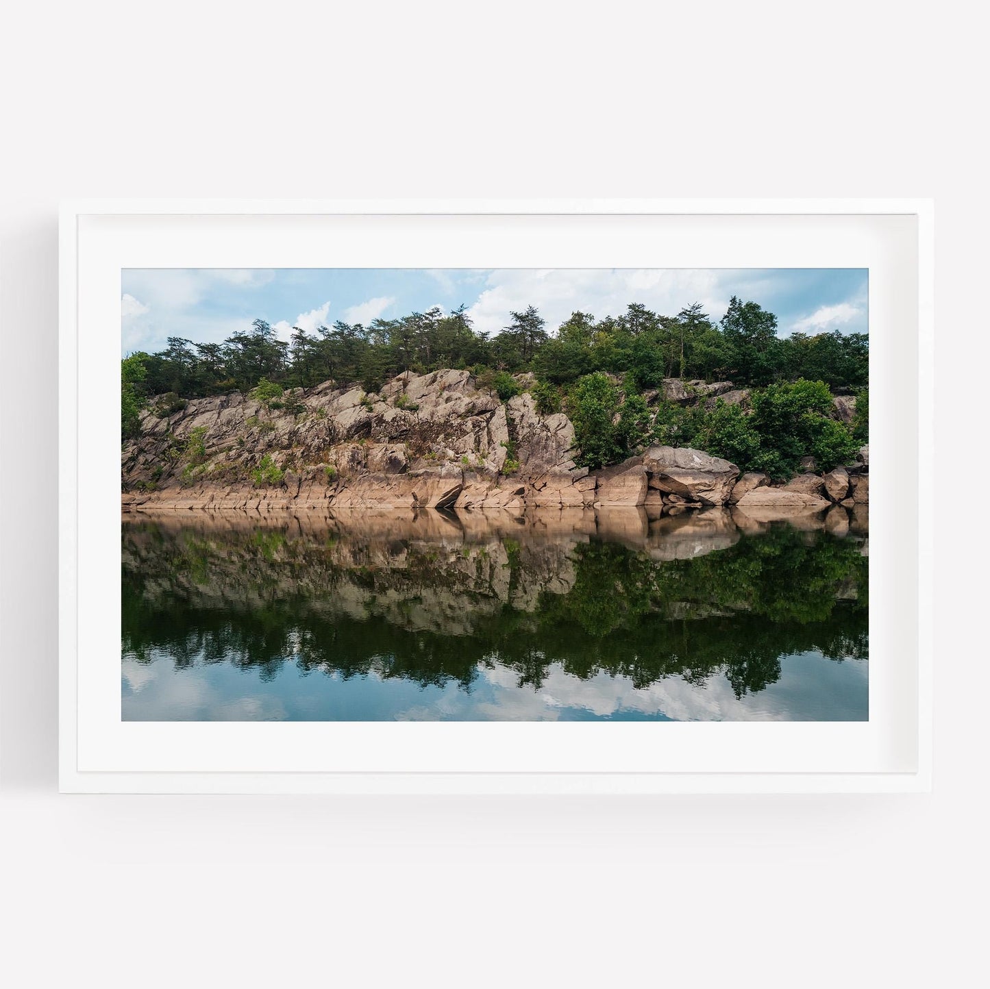 Framed Great Falls Park photo: rocky cliff with trees reflected in a calm river under a partly cloudy sky.
