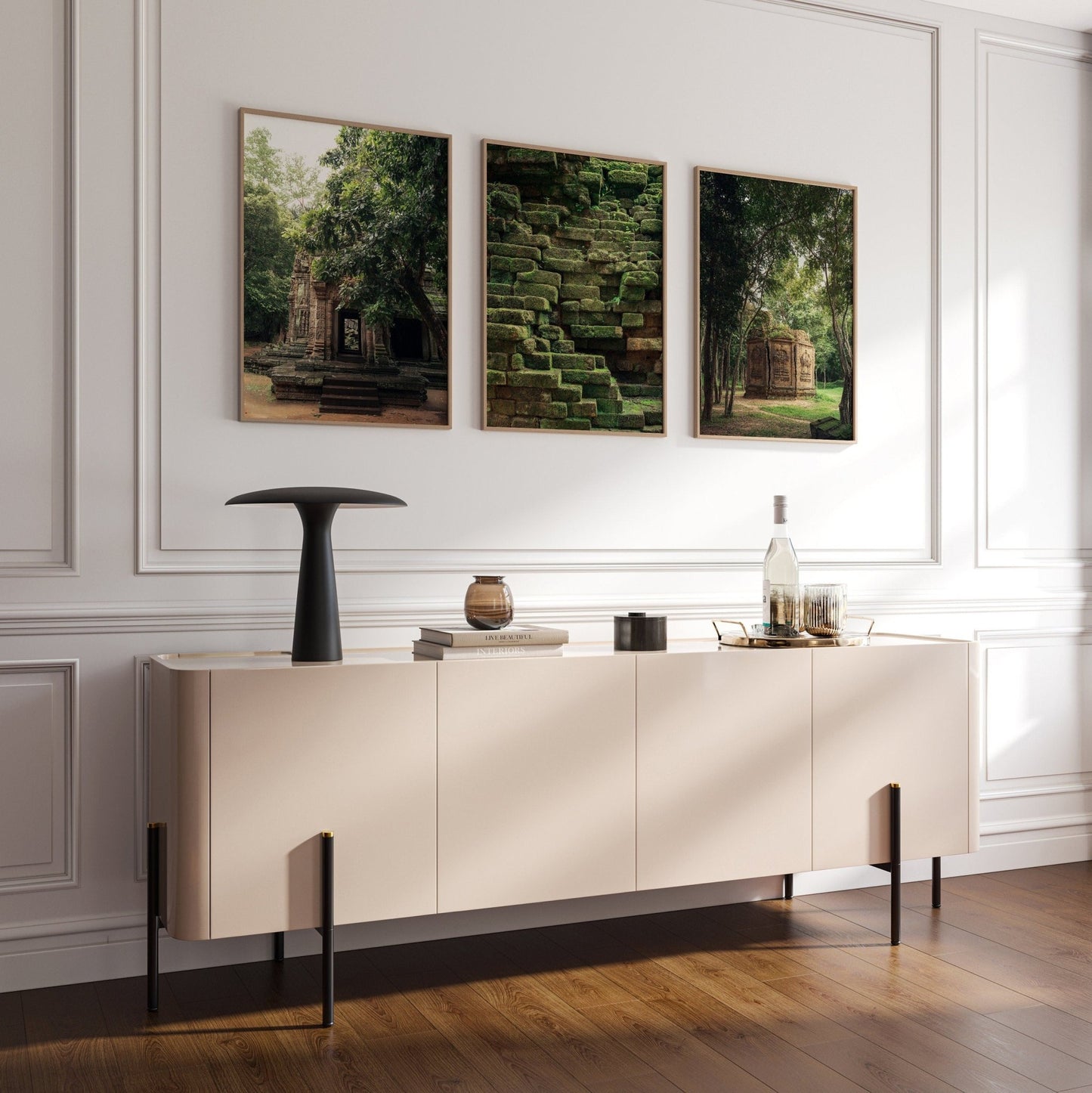 Modern living room with the Green Peace sideboard, decor items, and three nature-themed artworks on the wall.