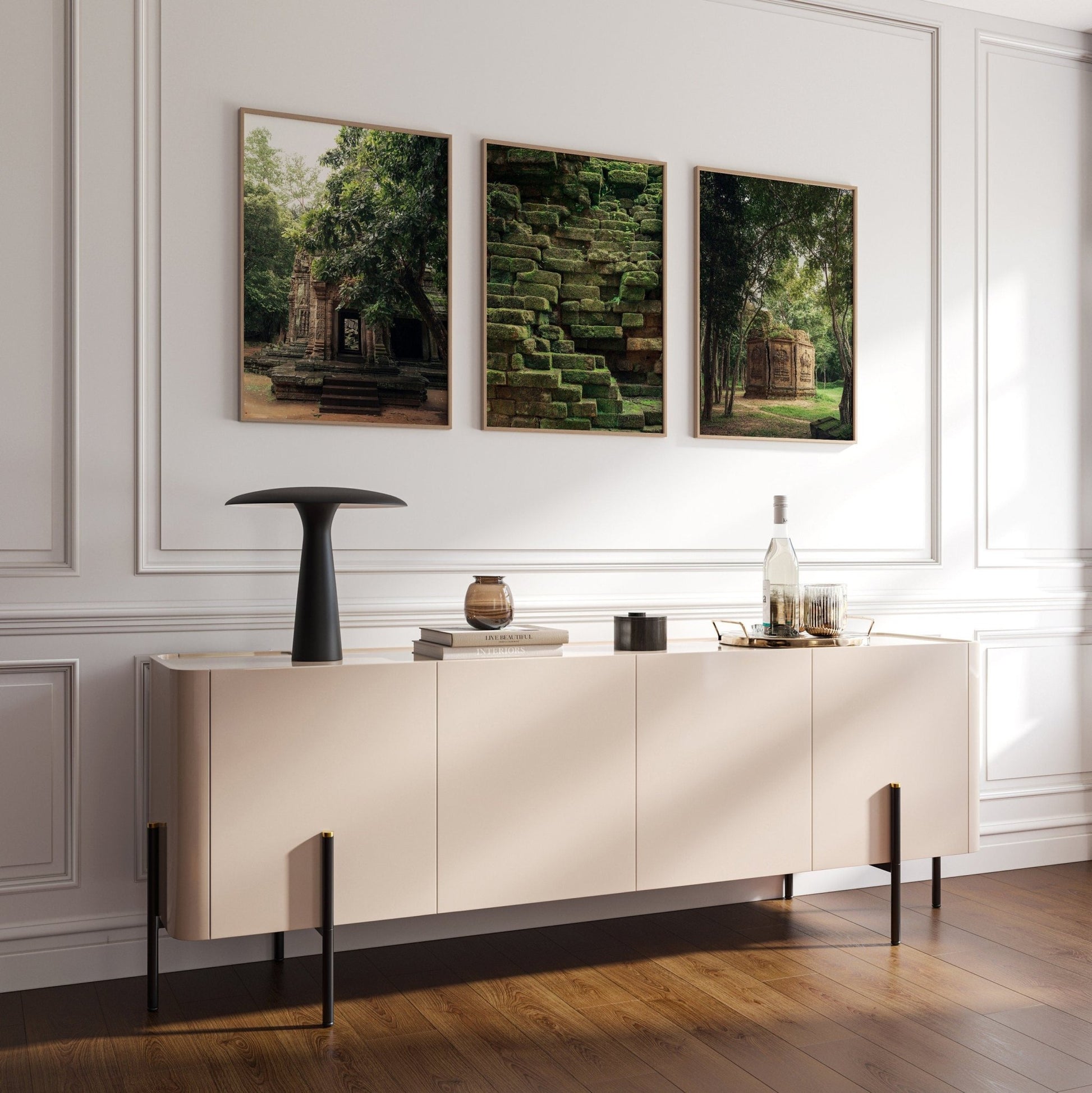 Modern living room with the Green Peace sideboard, decor items, and three nature-themed artworks on the wall.