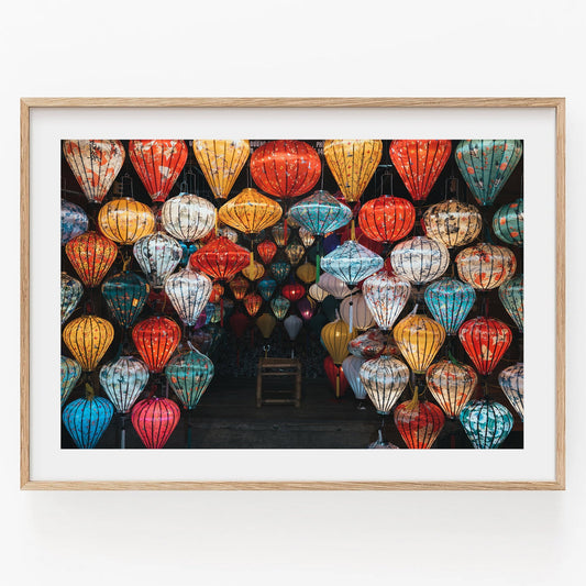 A framed photo titled Hoi An Lanterns II shows colorful lanterns of various shapes and sizes densely displayed in a shop.