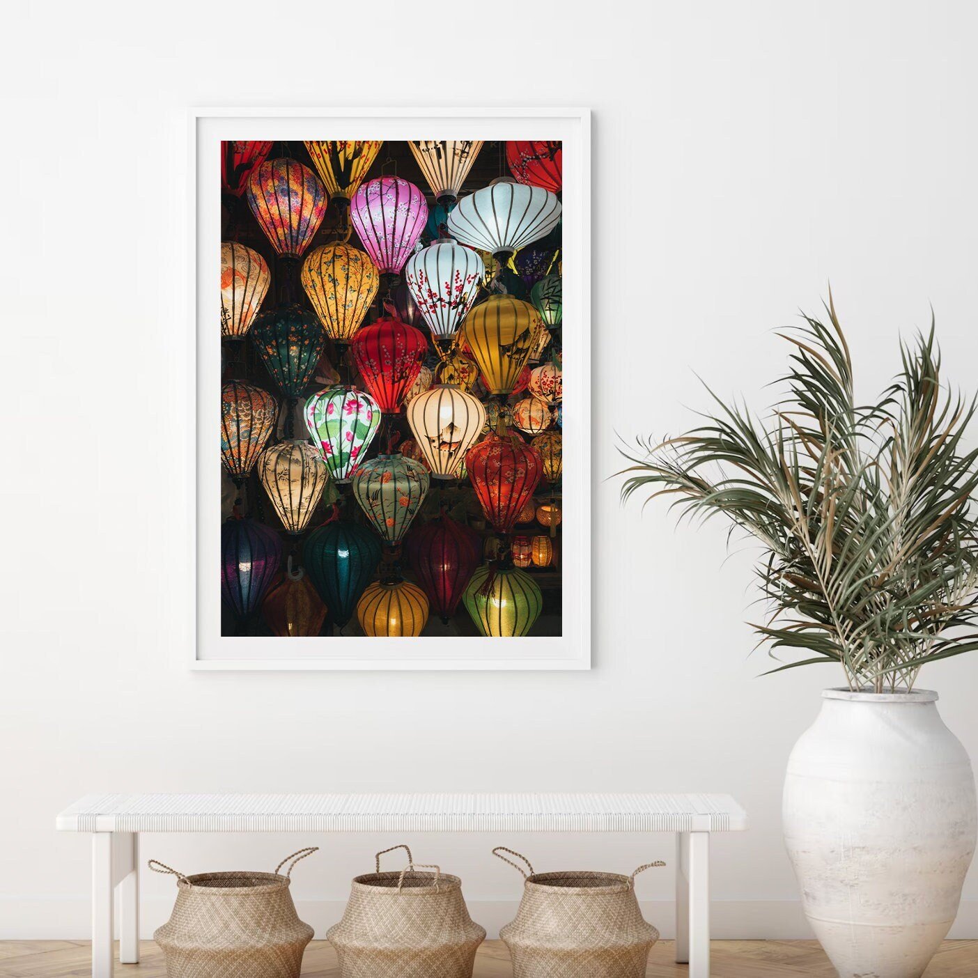 Hoi An Lanterns framed art features vibrant lanterns beside a white bench and potted plant.