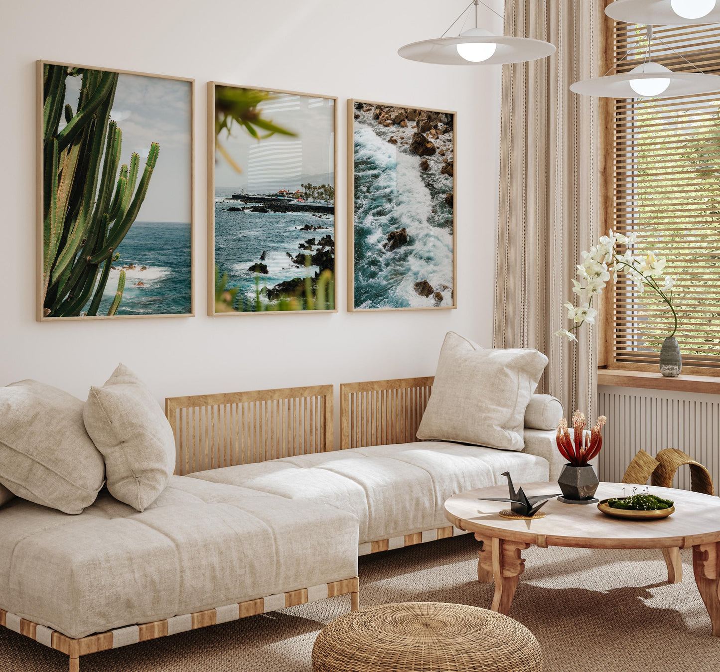A cozy living room with beige sofas, a wooden table, and the Puerto de la Cruz - Set of 3 on the wall.