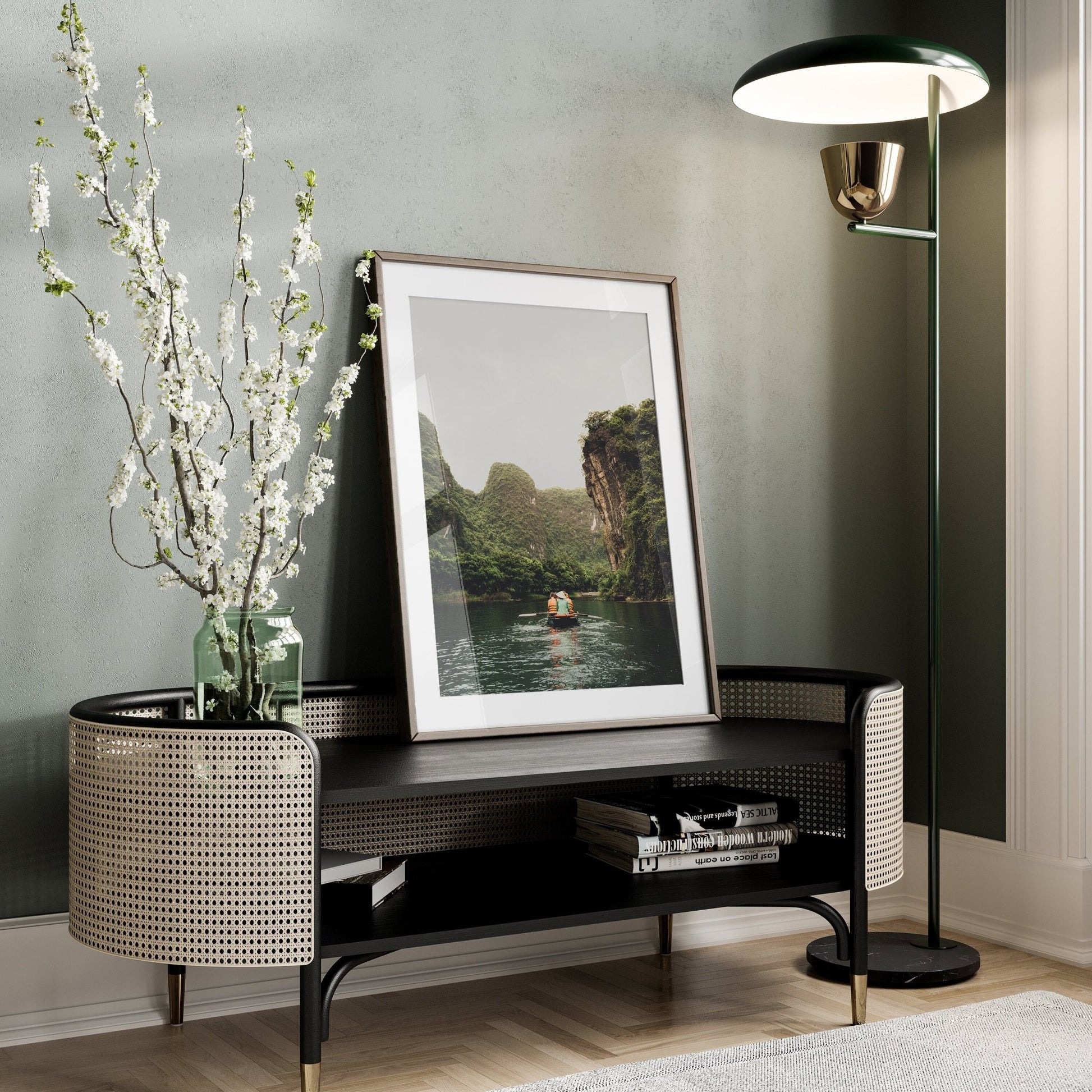 Modern room with a floor lamp, Limestone Waterway framed photo on a console table, and a vase with white flowers.