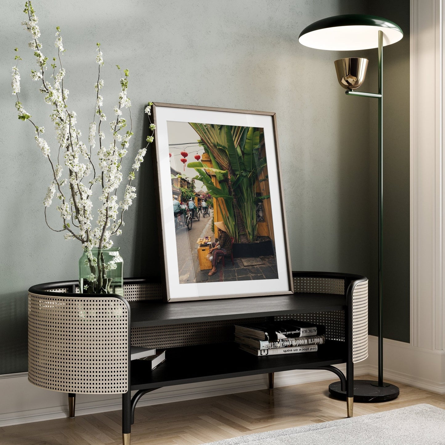 A Local Vendor photo, vase with flowers, and floor lamp decorate a stylish corner table.