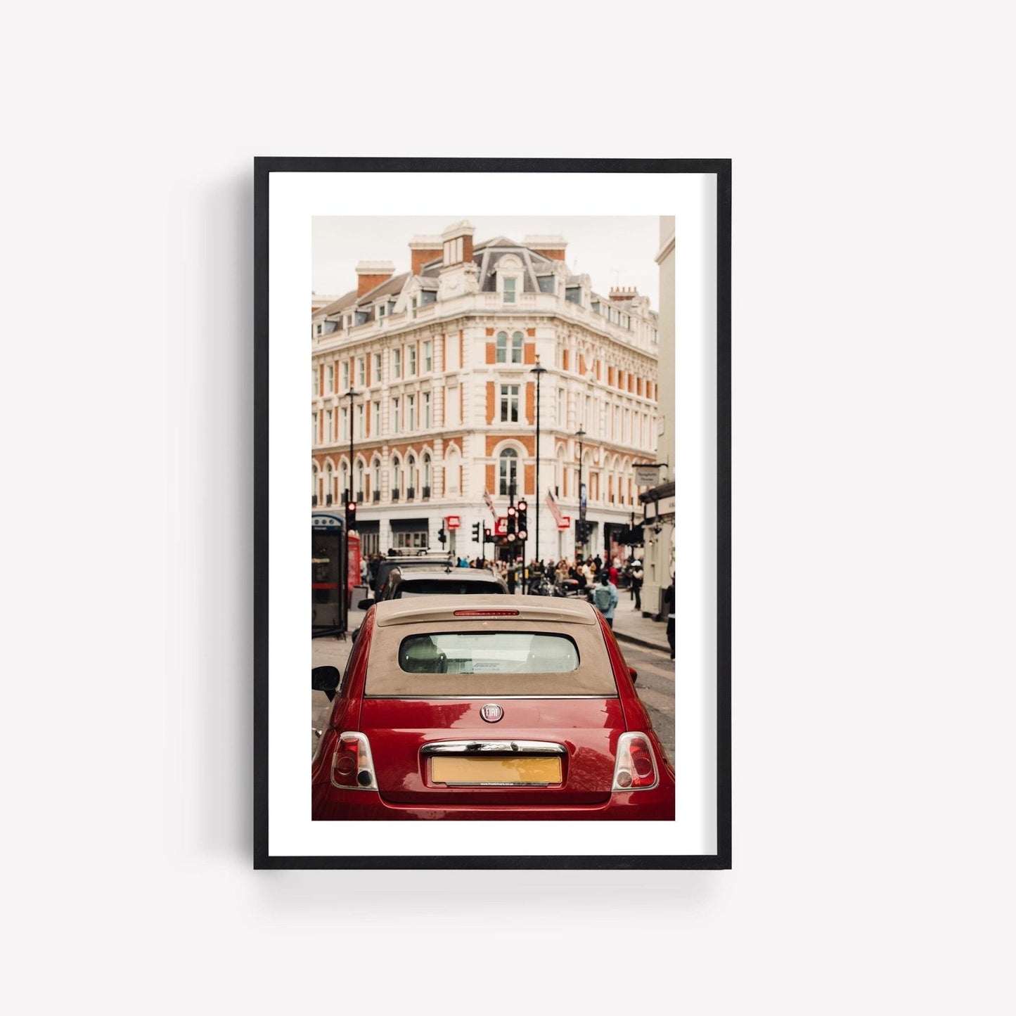 Framed photo titled London Fiat, featuring a red car with historic buildings in the background.