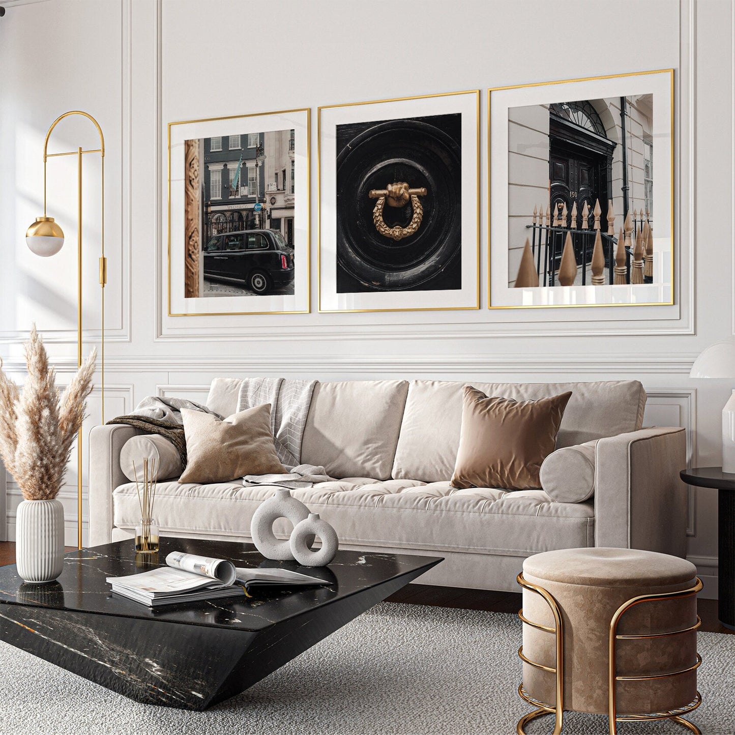 Stylish living room featuring London Flair - Set of 3, a beige sofa, modern art, pampas grass, and a black marble table.