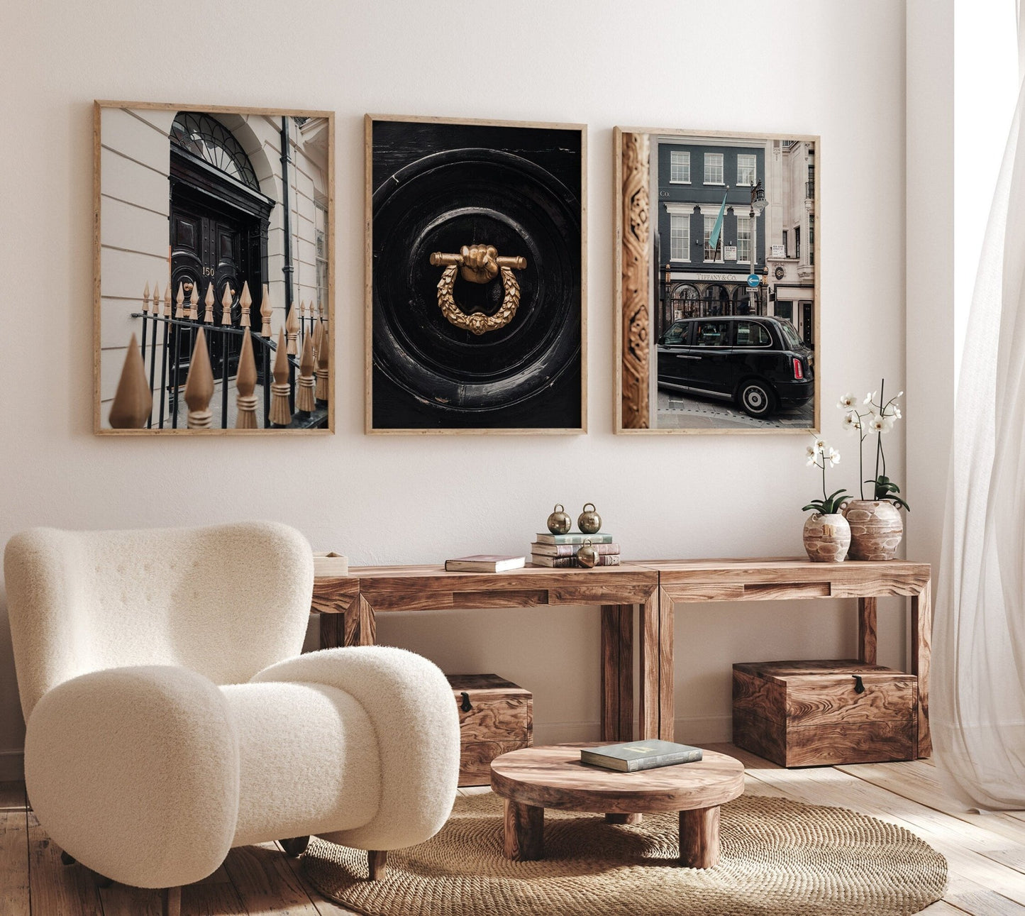 Cozy room with a plush chair, wooden table, decor, and the London Flair - Set of 3 framed art pieces on the wall.