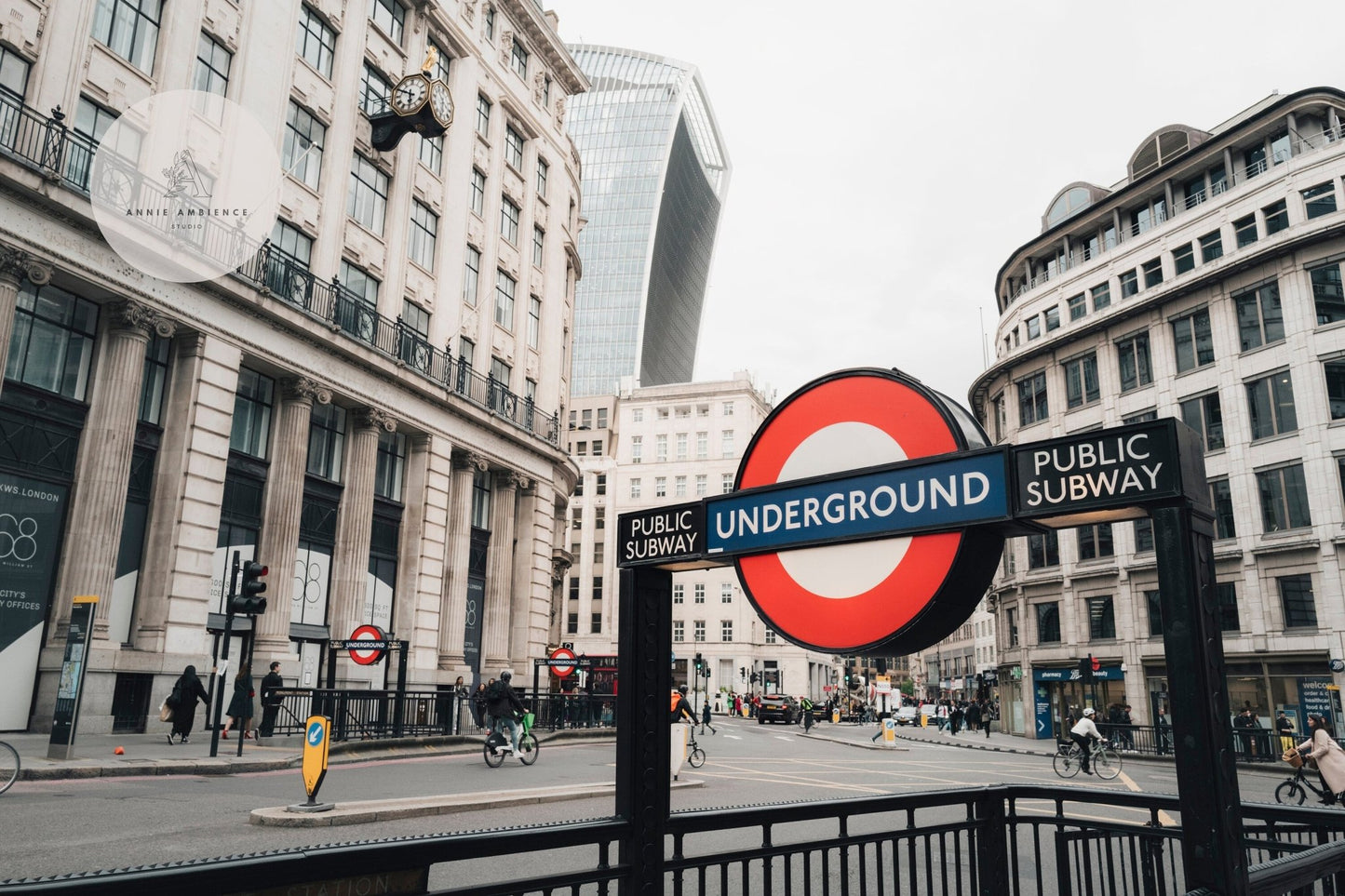 London street scene featuring the London Tube sign with the Walkie Talkie building in the background.