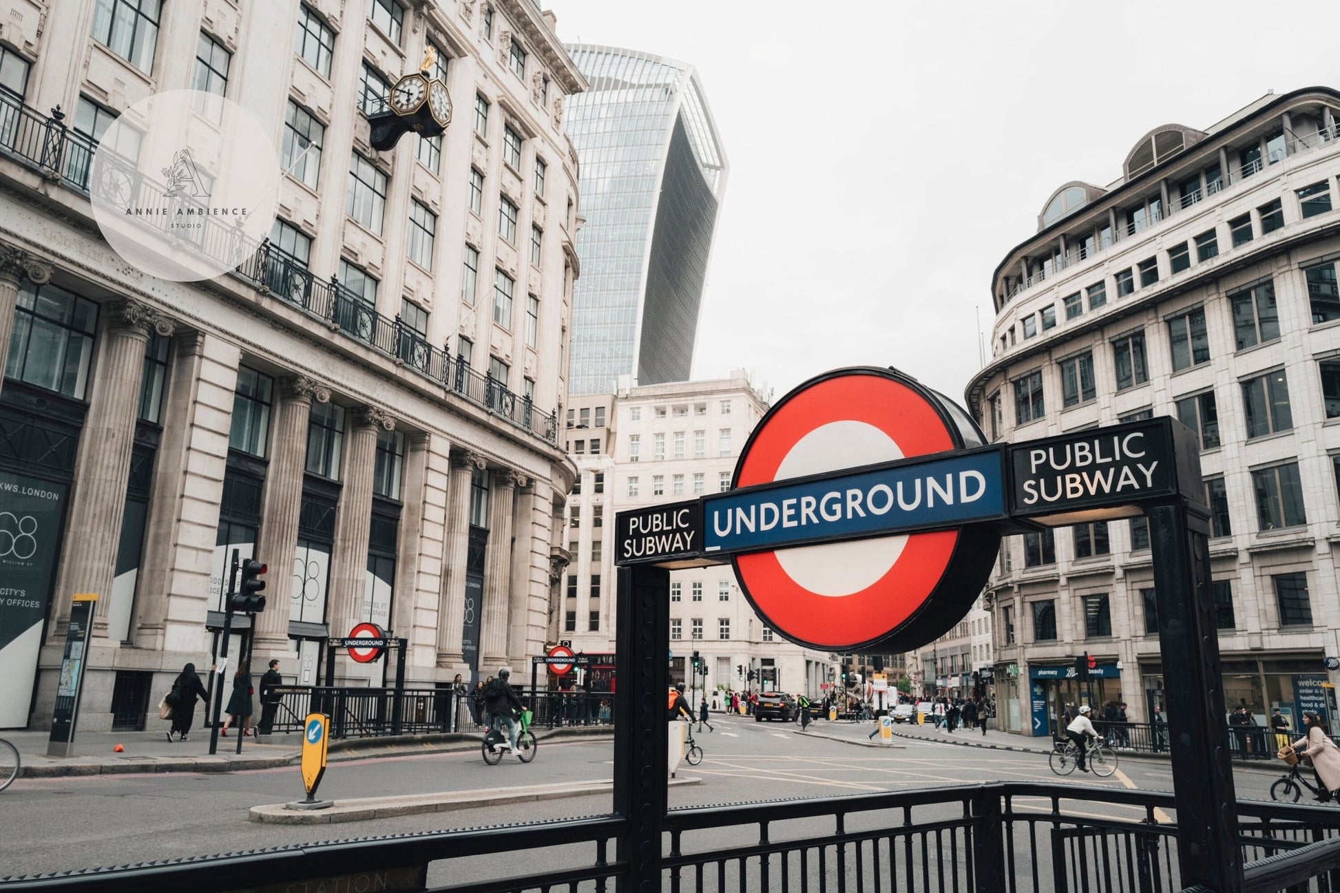 London street scene featuring the London Tube sign with the Walkie Talkie building in the background.
