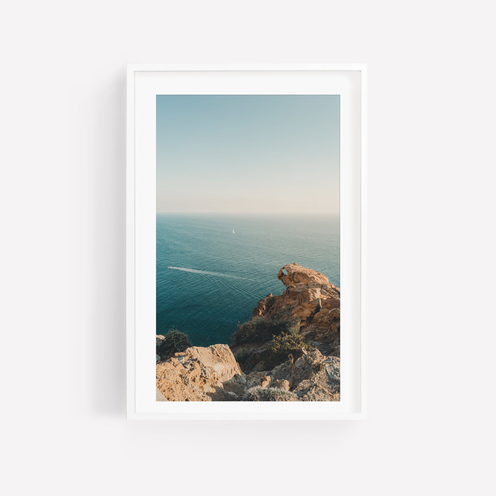 Set of 3 framed photos: rocky cliffs, calm blue sea, and distant boat under a clear Mediterranean sky.