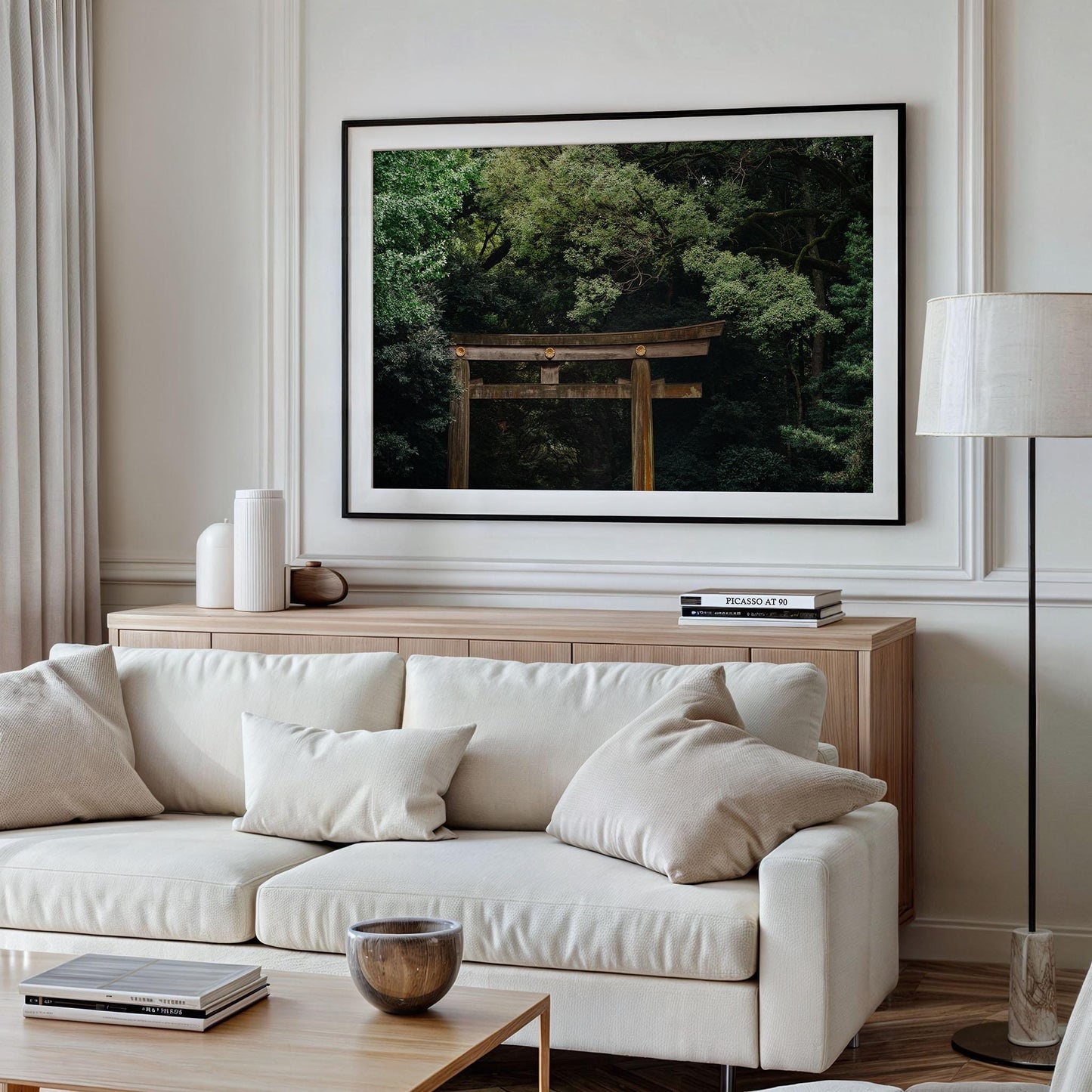 Modern living room with beige sofa, neutral decor, and a Meiji Jingu Shrine photo framed on the wall.