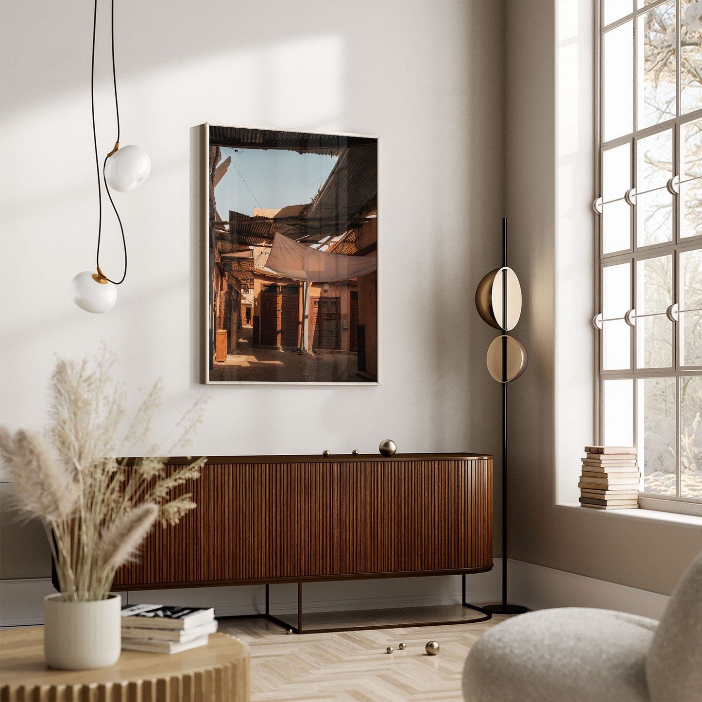 A cozy living room with modern decor, featuring Morning Shadow wall art, a sideboard, a unique floor lamp, and a large window.