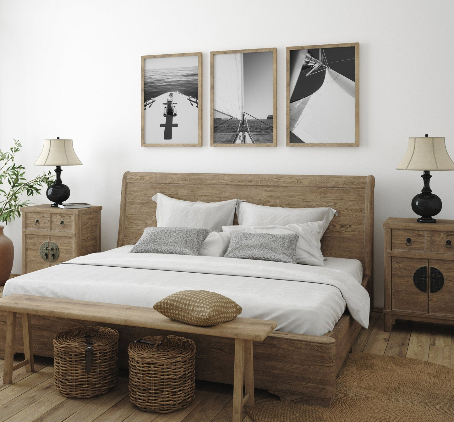 A cozy bedroom with a wooden bed, matching furniture, and Nautical Elegance Black and White - Set of 3 above the headboard.