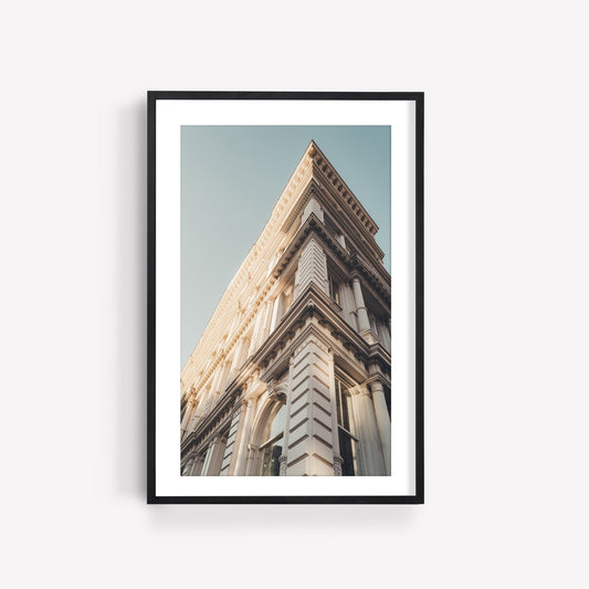 Framed photo titled Noho II features a classic building with ornate details set against a clear sky.