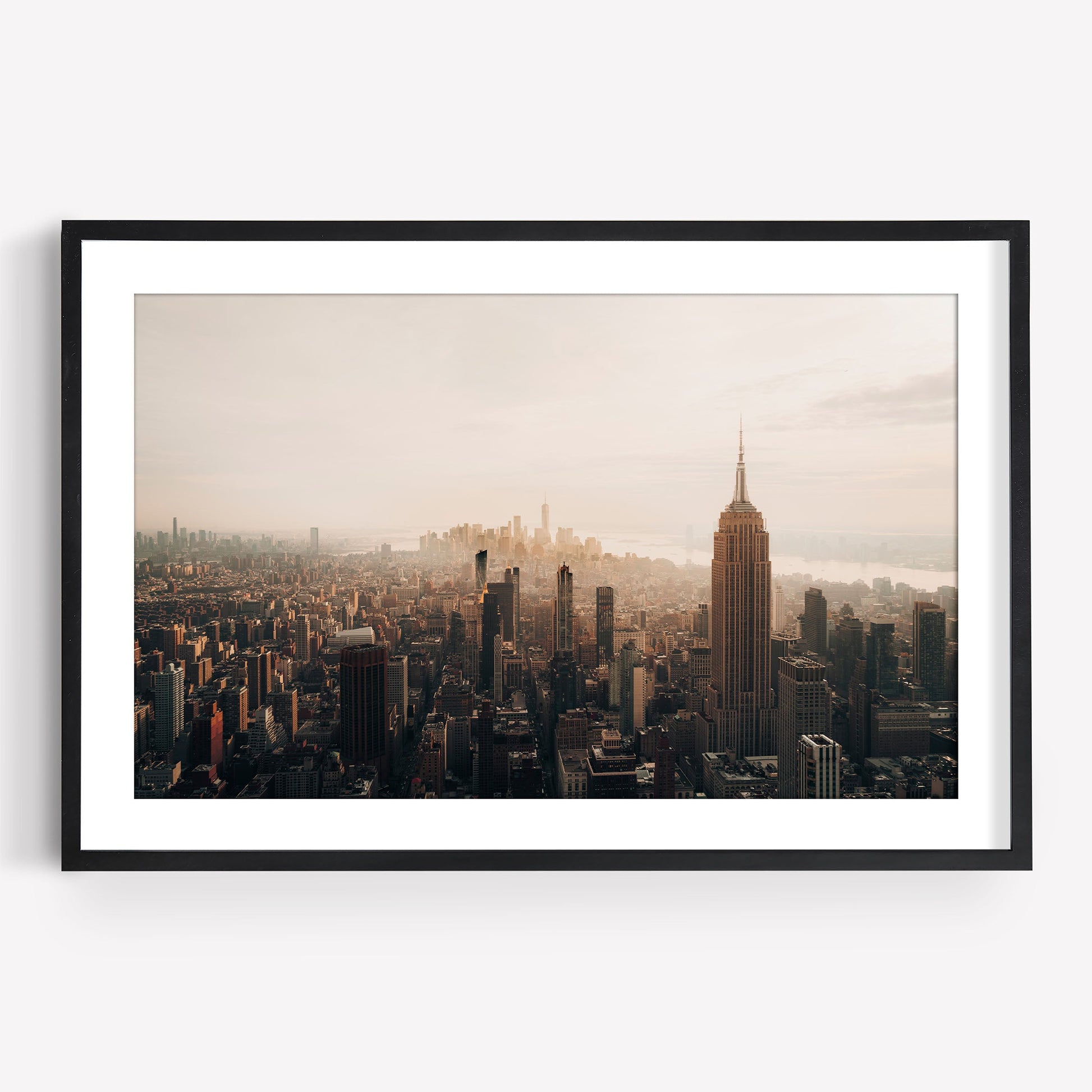 Framed photo of NYC Skyline Black and White featuring the Empire State Building at sunset, aerial view.