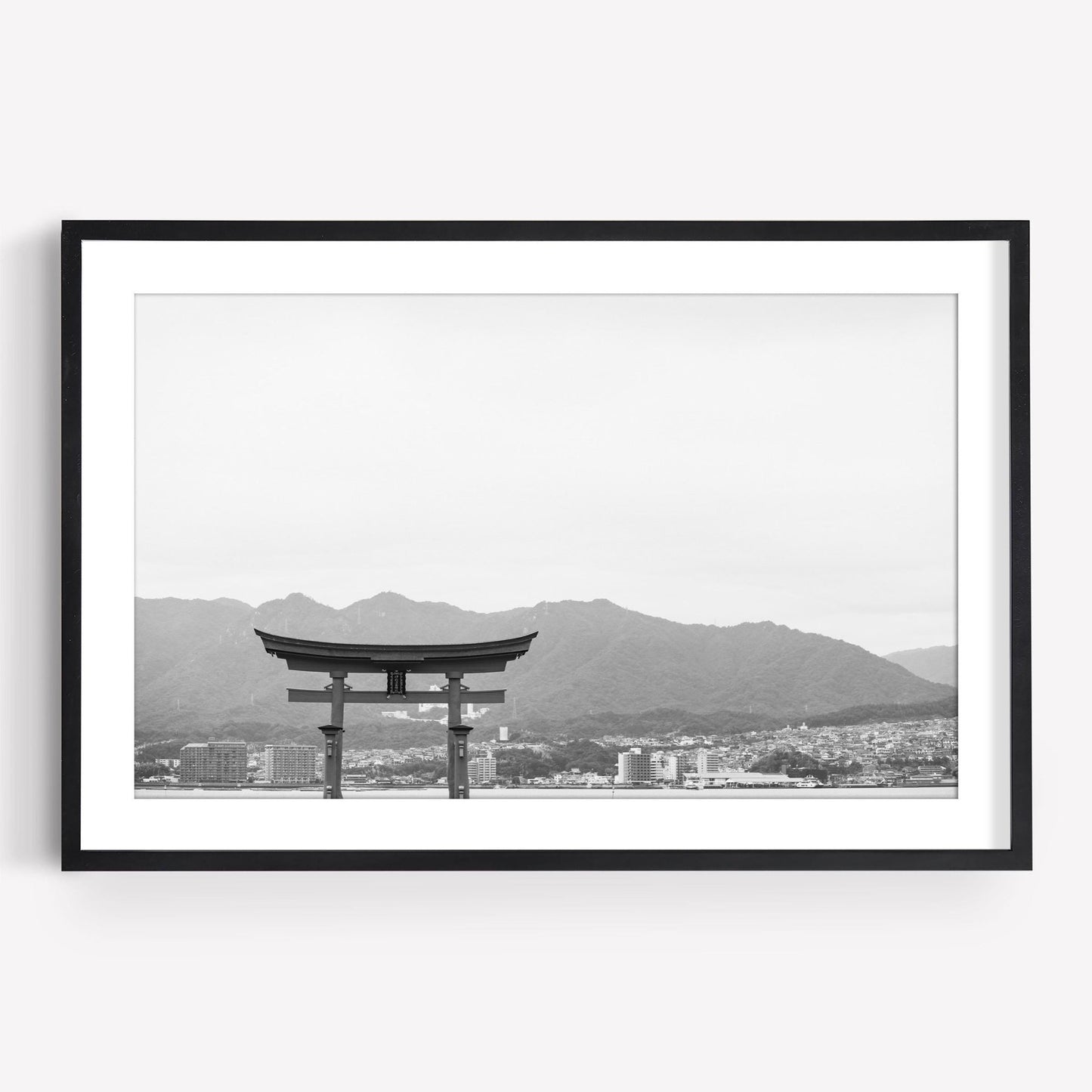 O-Torii Gate Black and White: black and white photo of a torii gate with cityscape and mountains, in a black frame.
