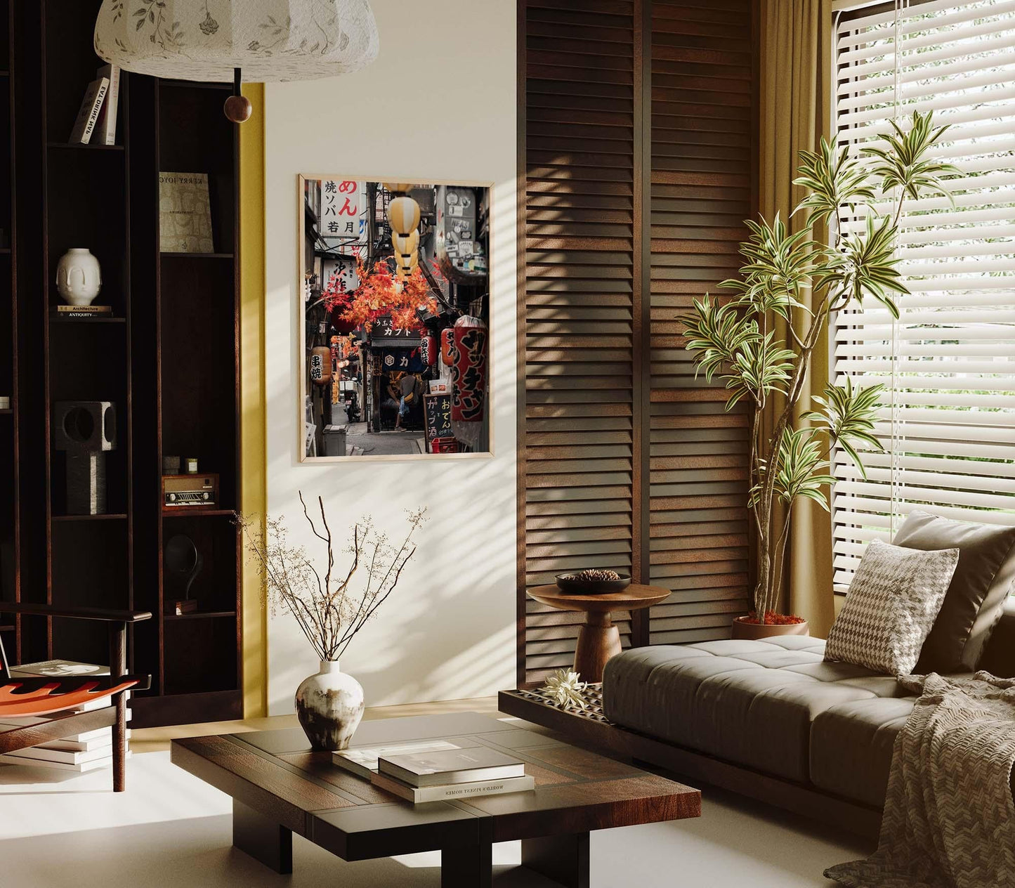 A cozy living room featuring a modern design, a large plant, and a framed cityscape photo titled Omoide Yokocho on the wall.