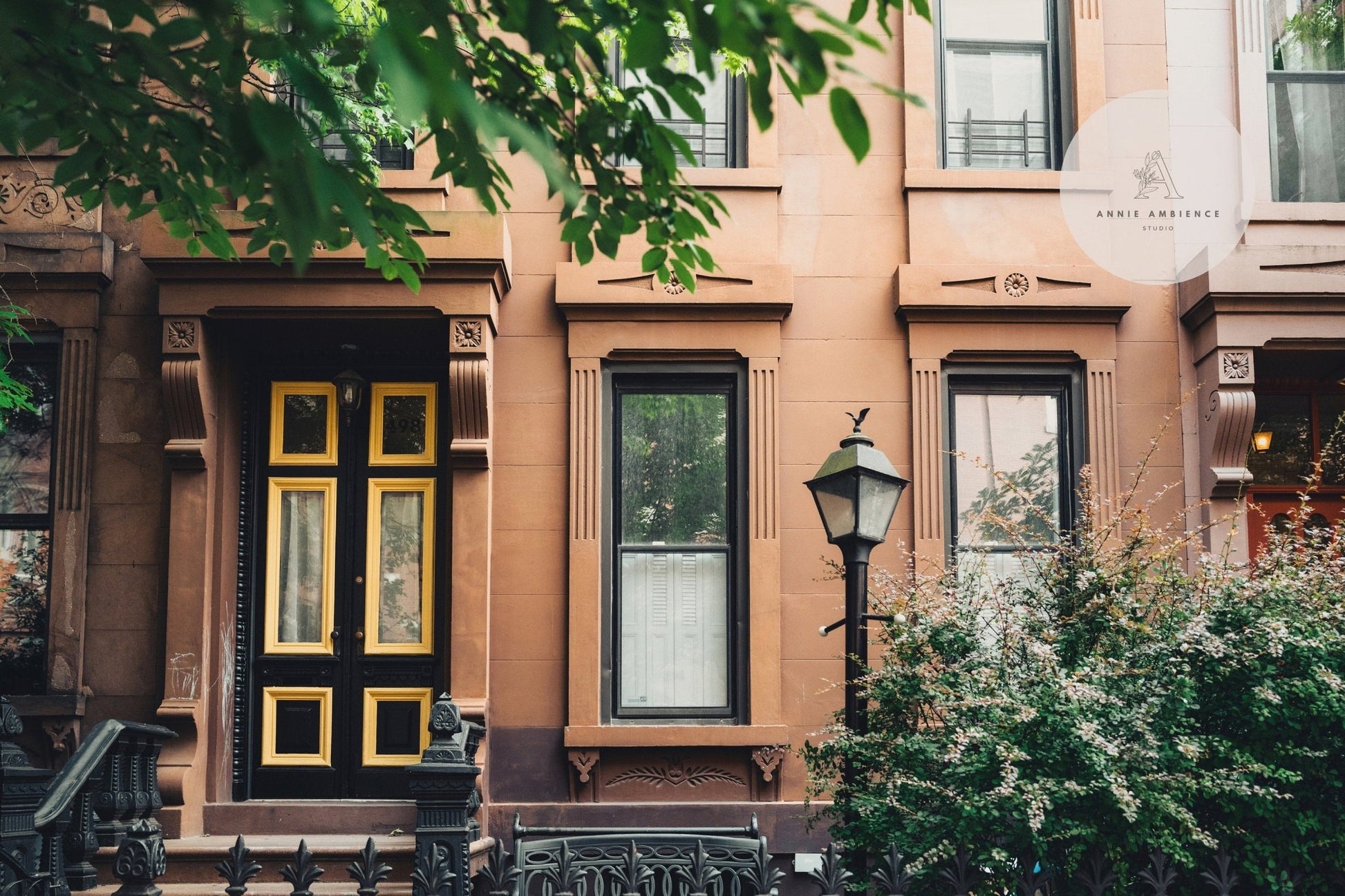 The Park Slope features a classic brownstone facade with black and gold doors, tall windows, and greenery in front.