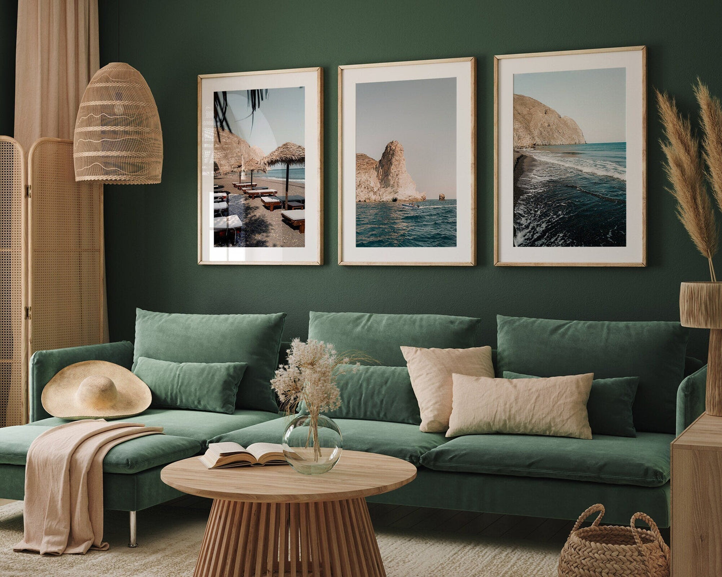 A cozy living room with a green sofa, beige accents, and the Perissa set of 3 framed seaside prints on a dark green wall.