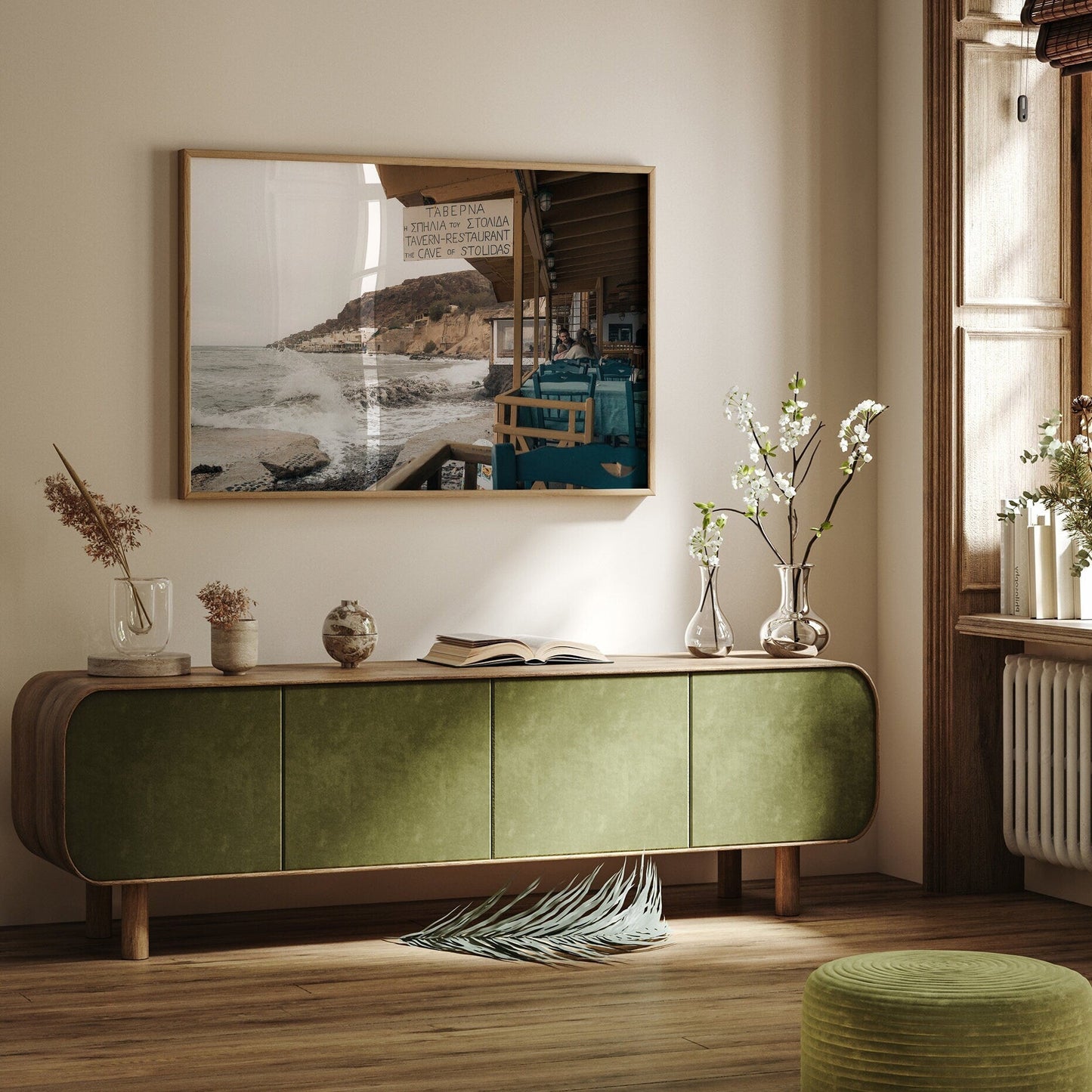 A cozy room featuring the Rainy Day green cabinet, floral decor, and a seaside painting on the wall.