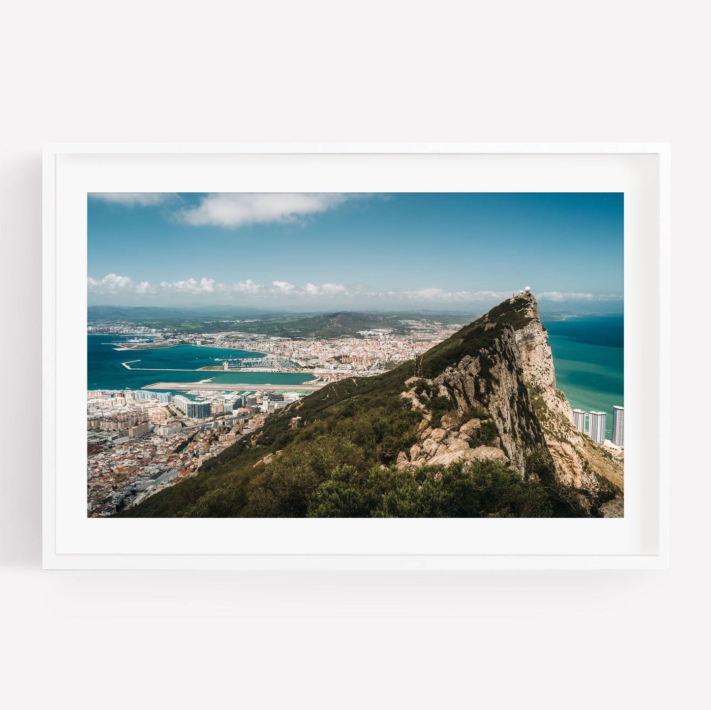 Framed photo of the Rock of Gibraltar, overlooking city, bay, and landscape.