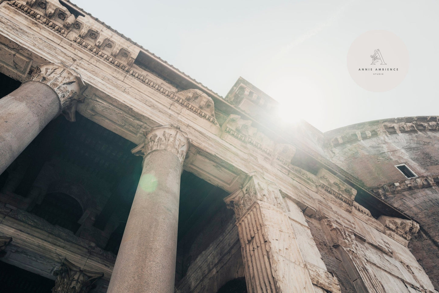 Low-angle view of Roman Pantheon I with ancient stone columns and sunlight filtering through.