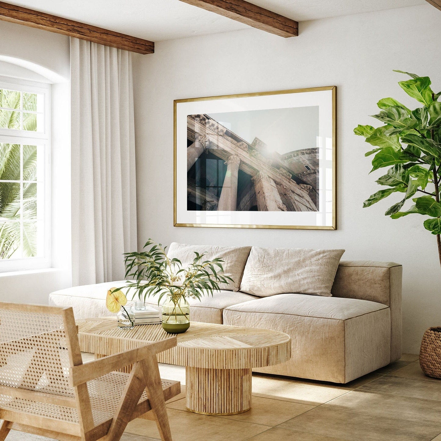 Bright living room with a beige sofa, Roman Pantheon I photo, wooden furniture, and a potted plant.