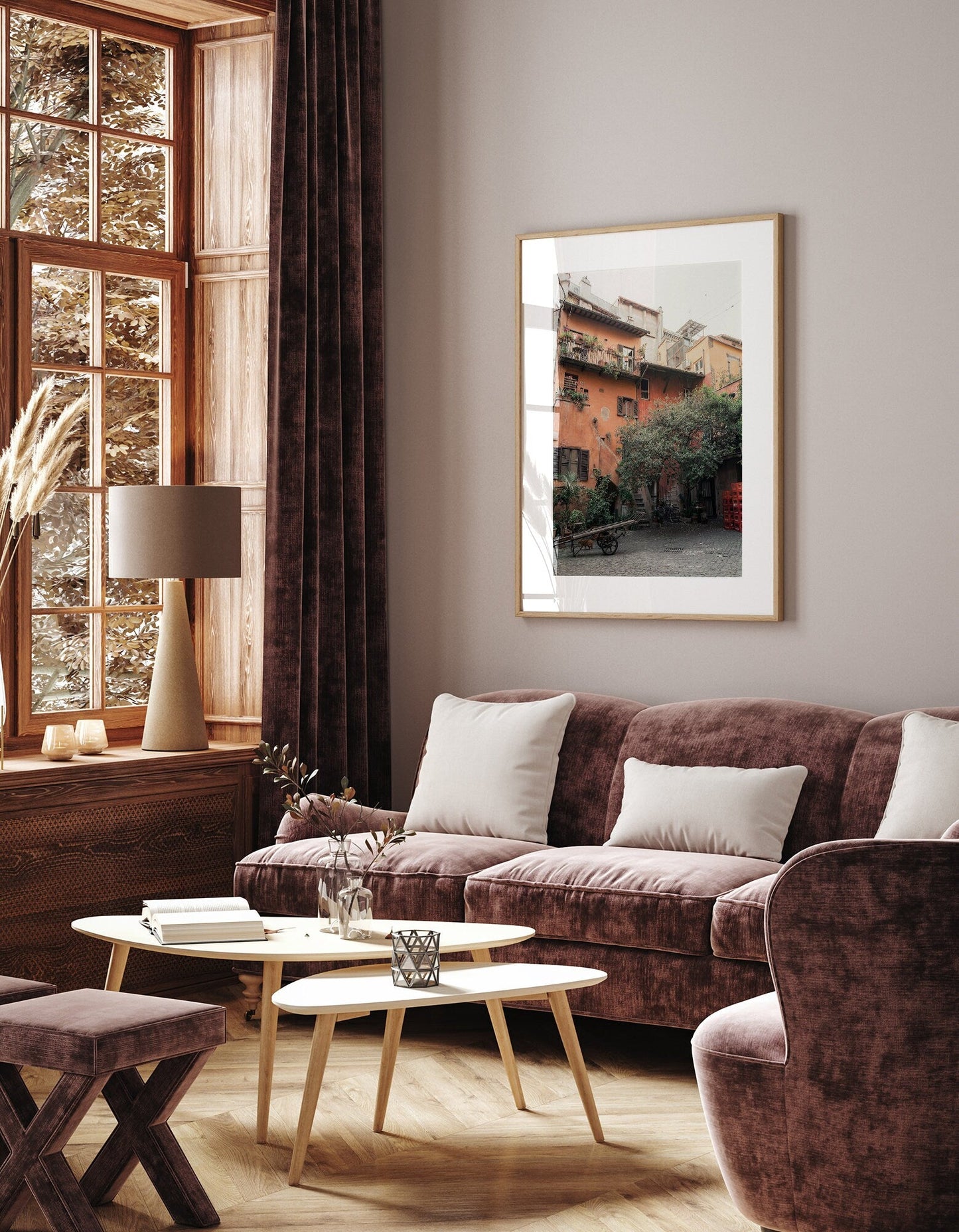 Cozy living room with Rome Courtyard art, plush furniture, and a window view of autumn.