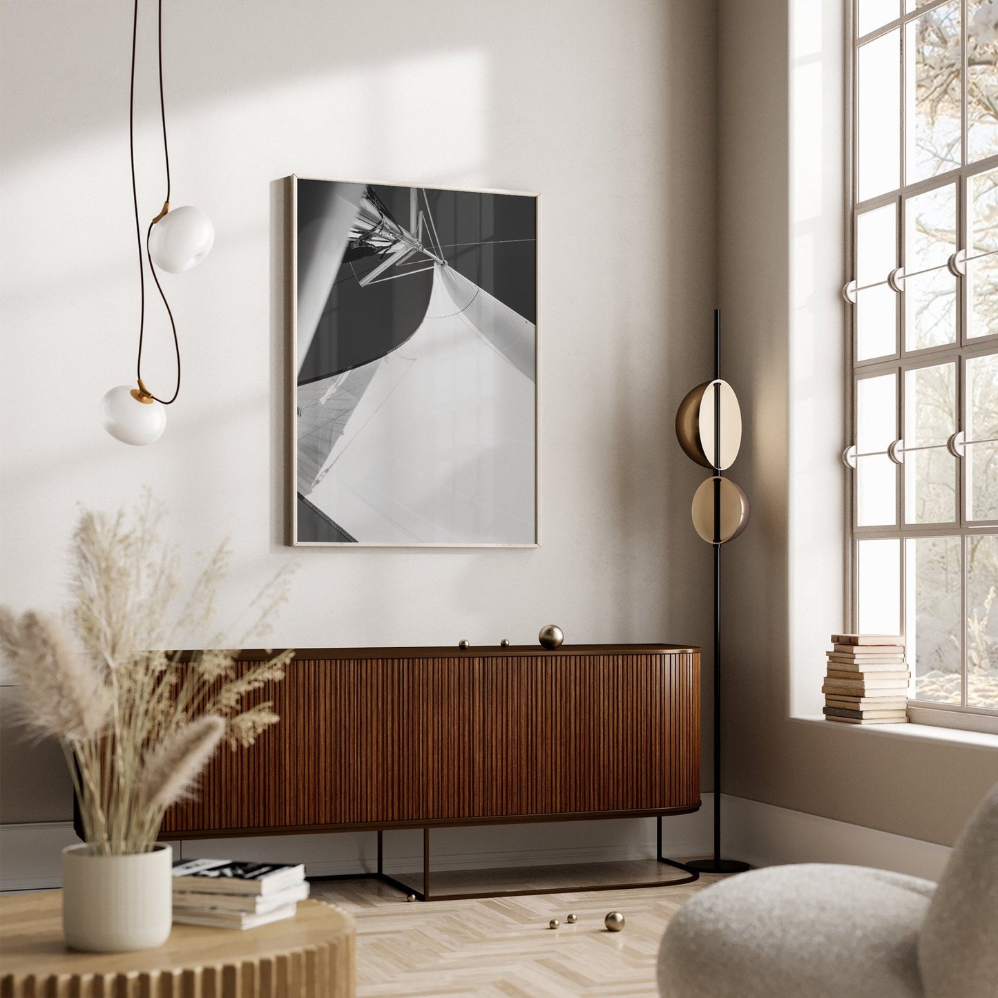 Minimalist living room with a wooden sideboard, Sailing Bliss II art, modern lighting, and a large window with natural light.