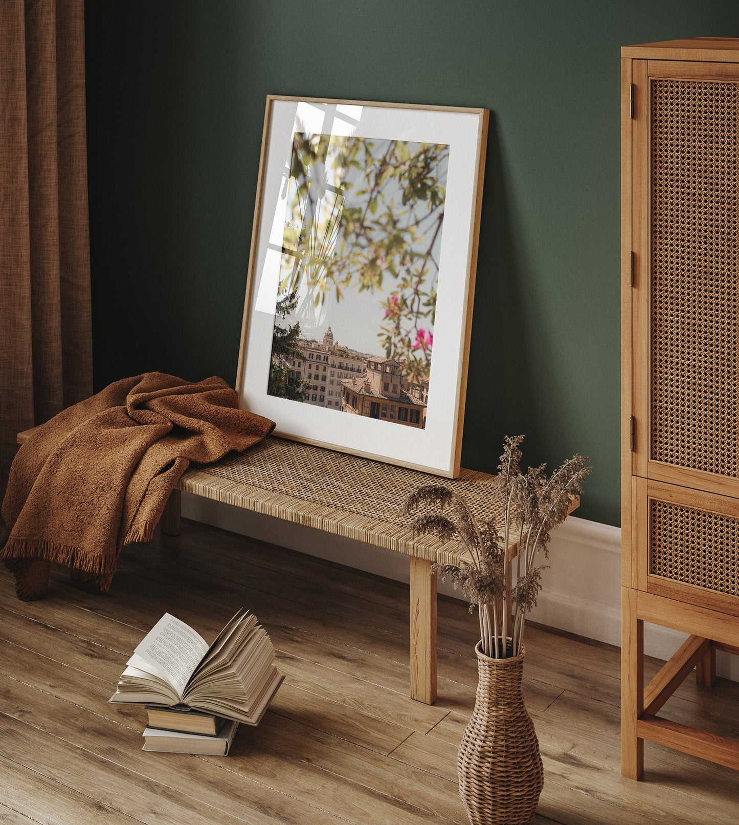 Spanish Steps View framed photo on woven bench with brown blanket, open book, and vase in a cozy room.