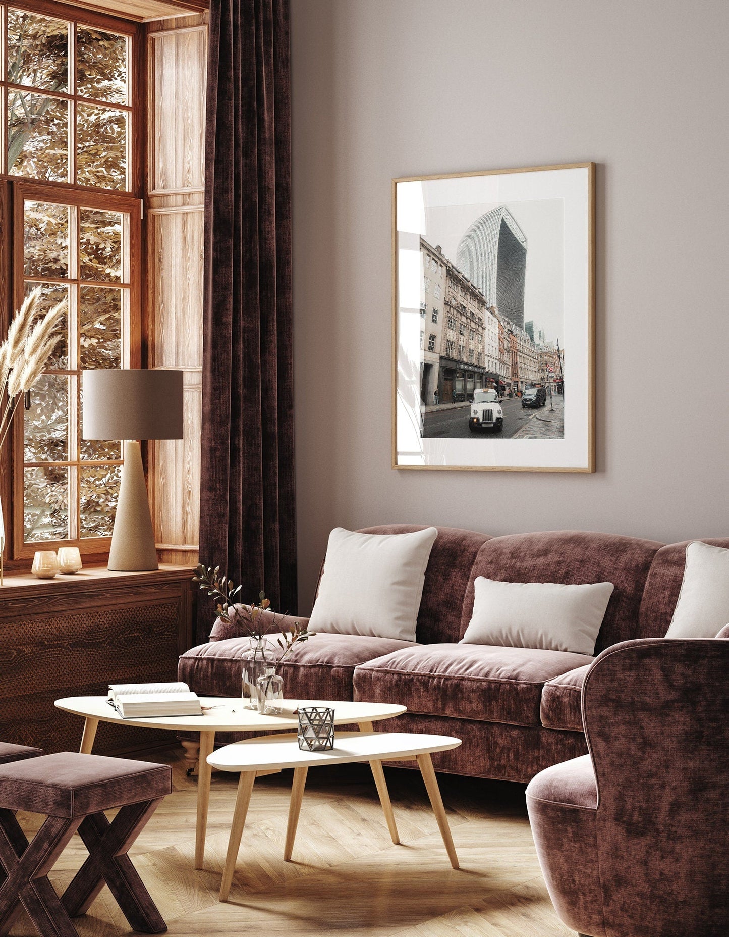 Cozy living room with a velvet sofa, Streets of London photo, and wooden furniture near a large window.