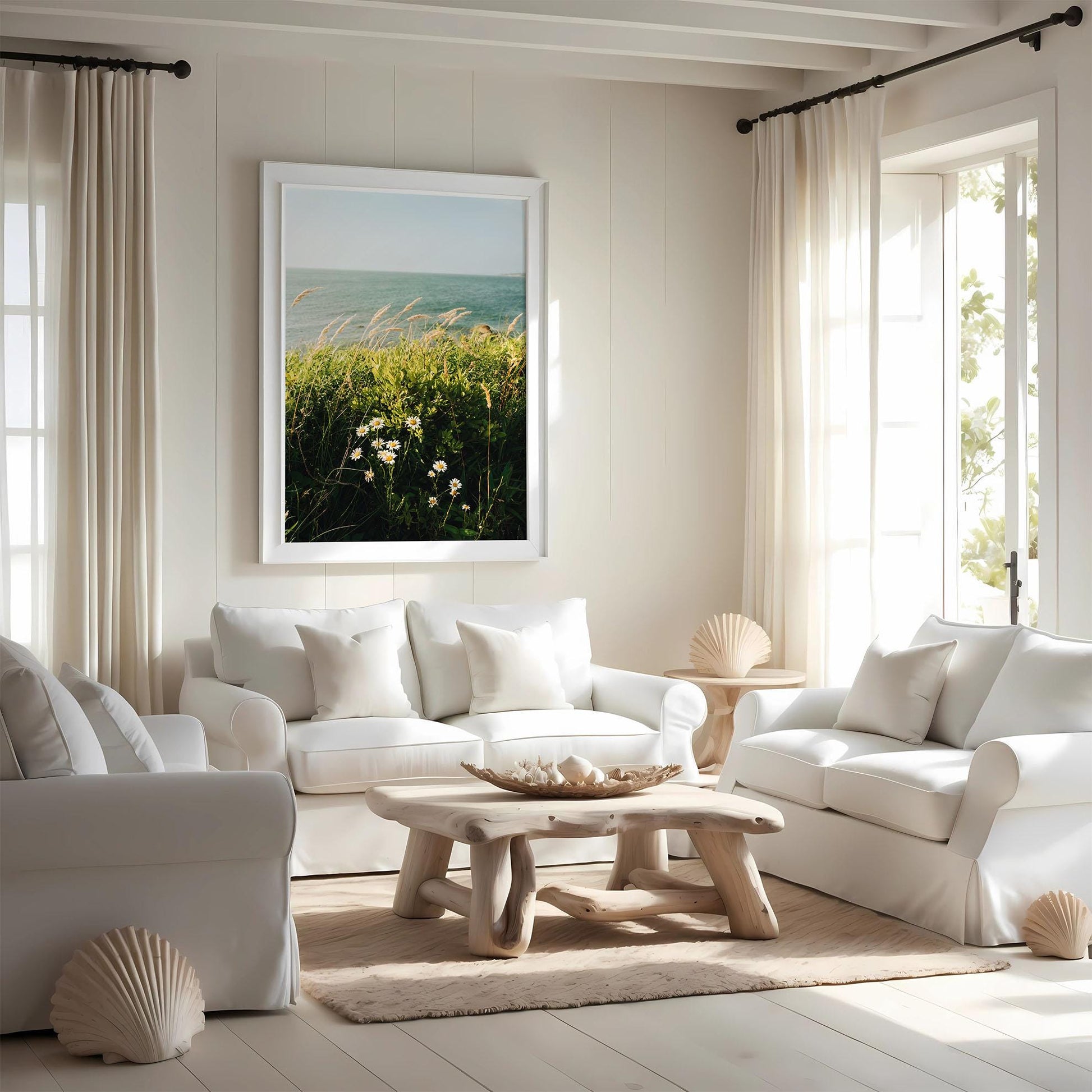 Bright, airy living room with white sofas, a wooden table, and the "Summer Breeze" painting on the wall.