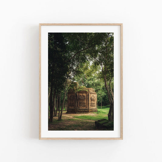 Framed photo Temple I showcasing an ancient stone structure amid lush green trees in a forest setting.