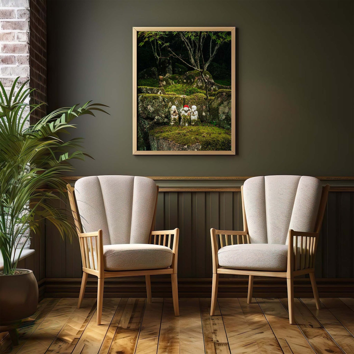A cozy room with green walls, a forest painting, wooden floor, a potted plant, and Three Wise Ones beige armchairs.