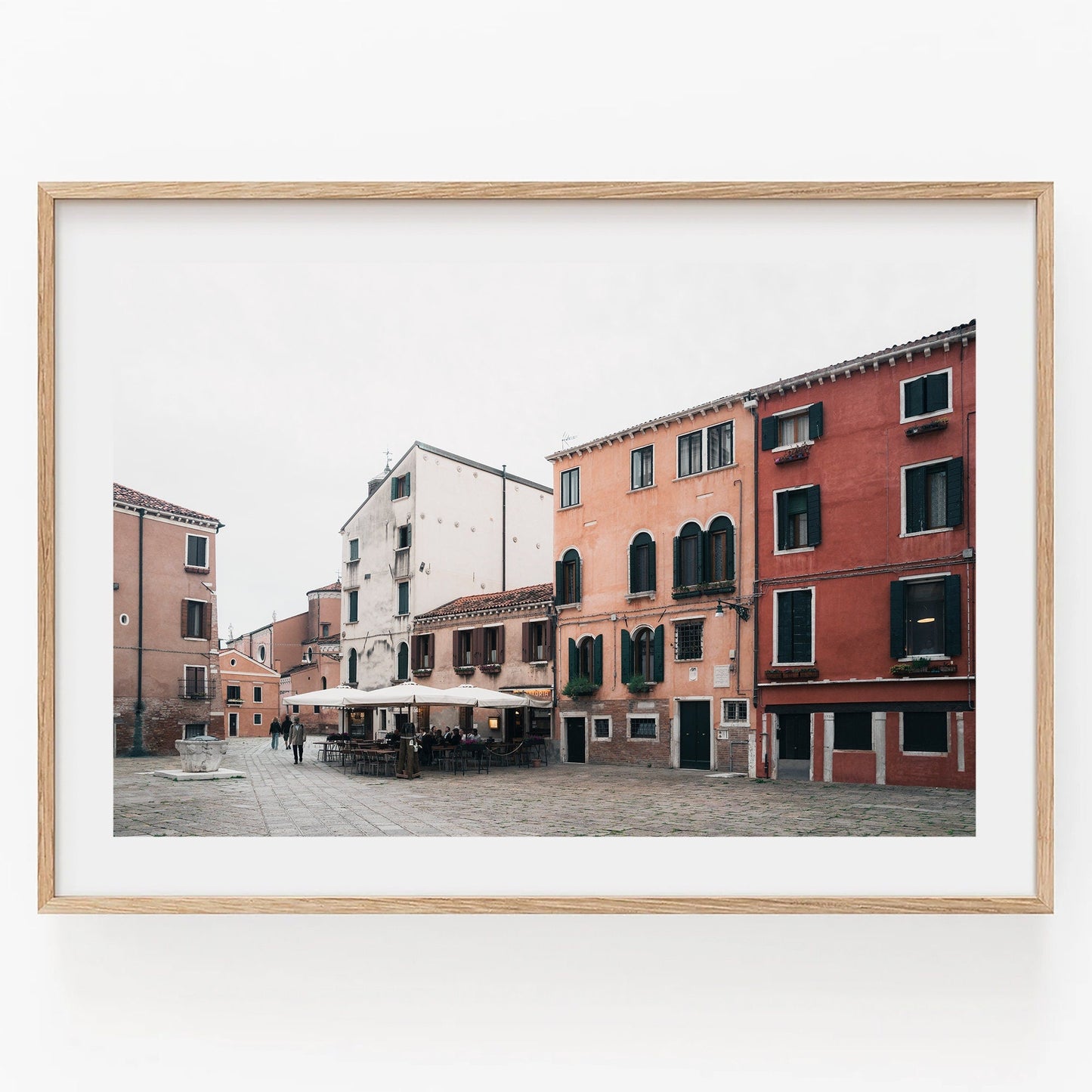 A framed photo titled Venice Piazza shows a colorful Italian street with orange and red buildings, and a cafe.