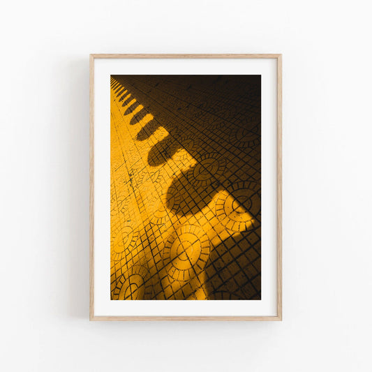 Yellow Harmony features a geometric pattern with circles and lines, framed in wood against a white background.