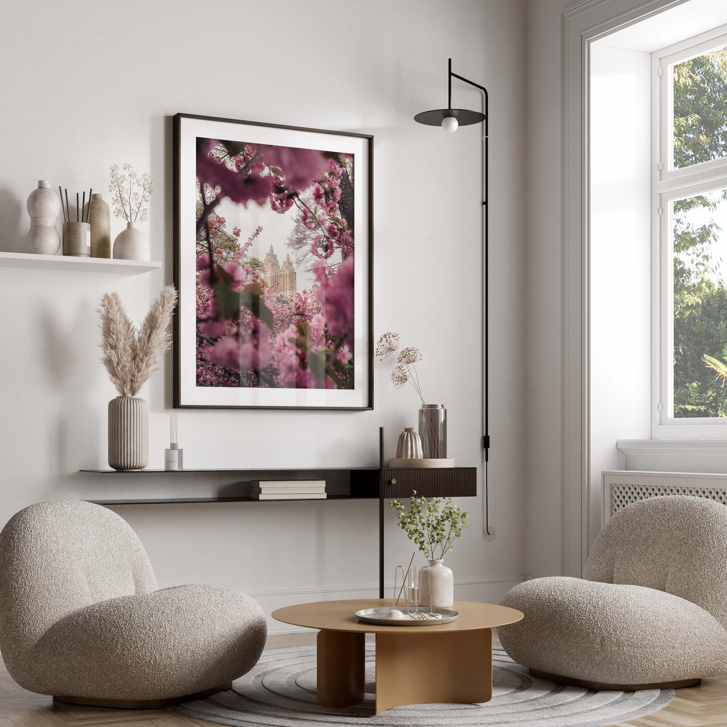 Modern living room with two round chairs, a low table, and the Cherry Blossom II wall art above minimalist shelves.